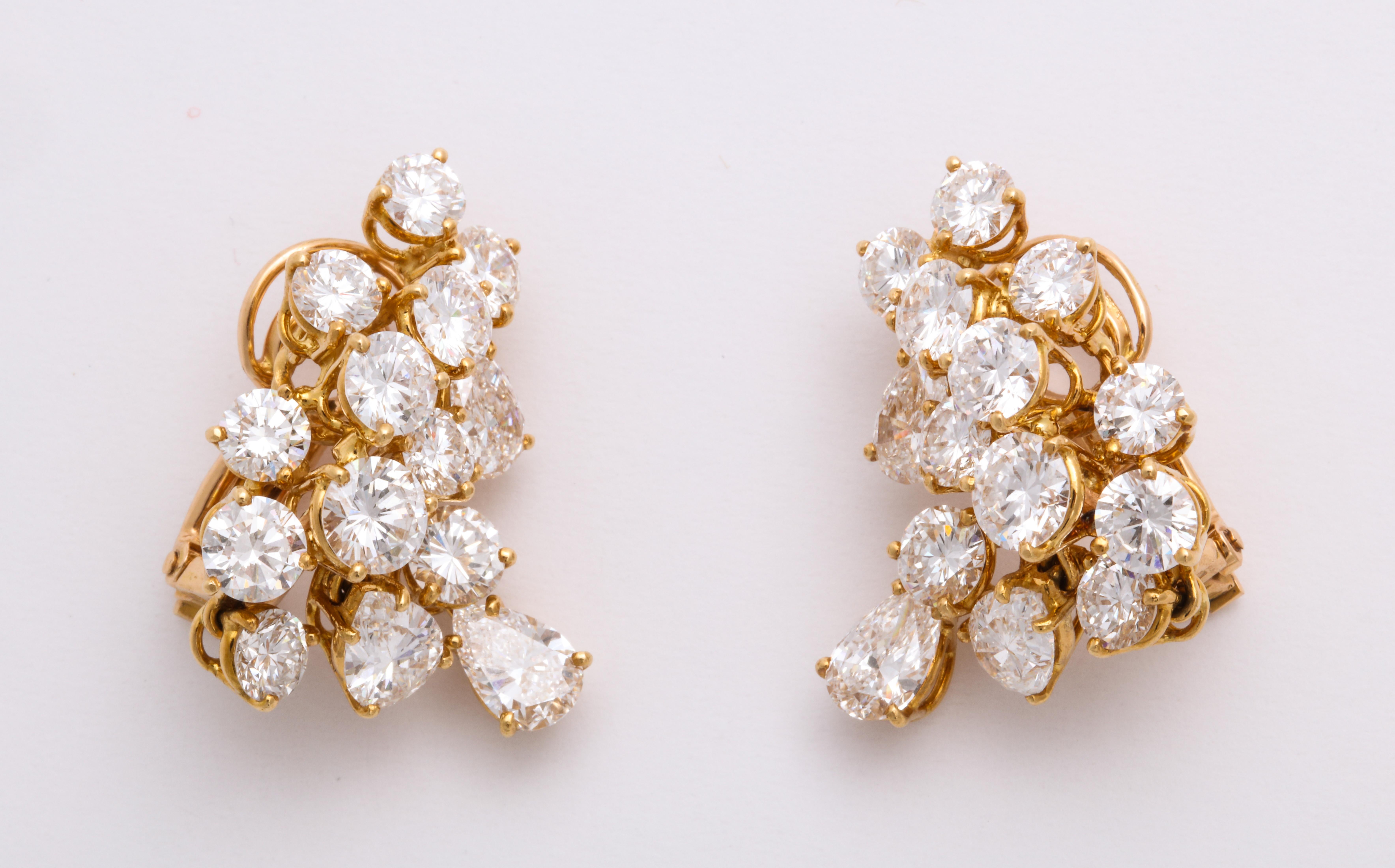 Timeless...Pair of 18KYG & Diamond ear clips signed Boucheron features 8.50cts est. total diamond weight.
c1960s