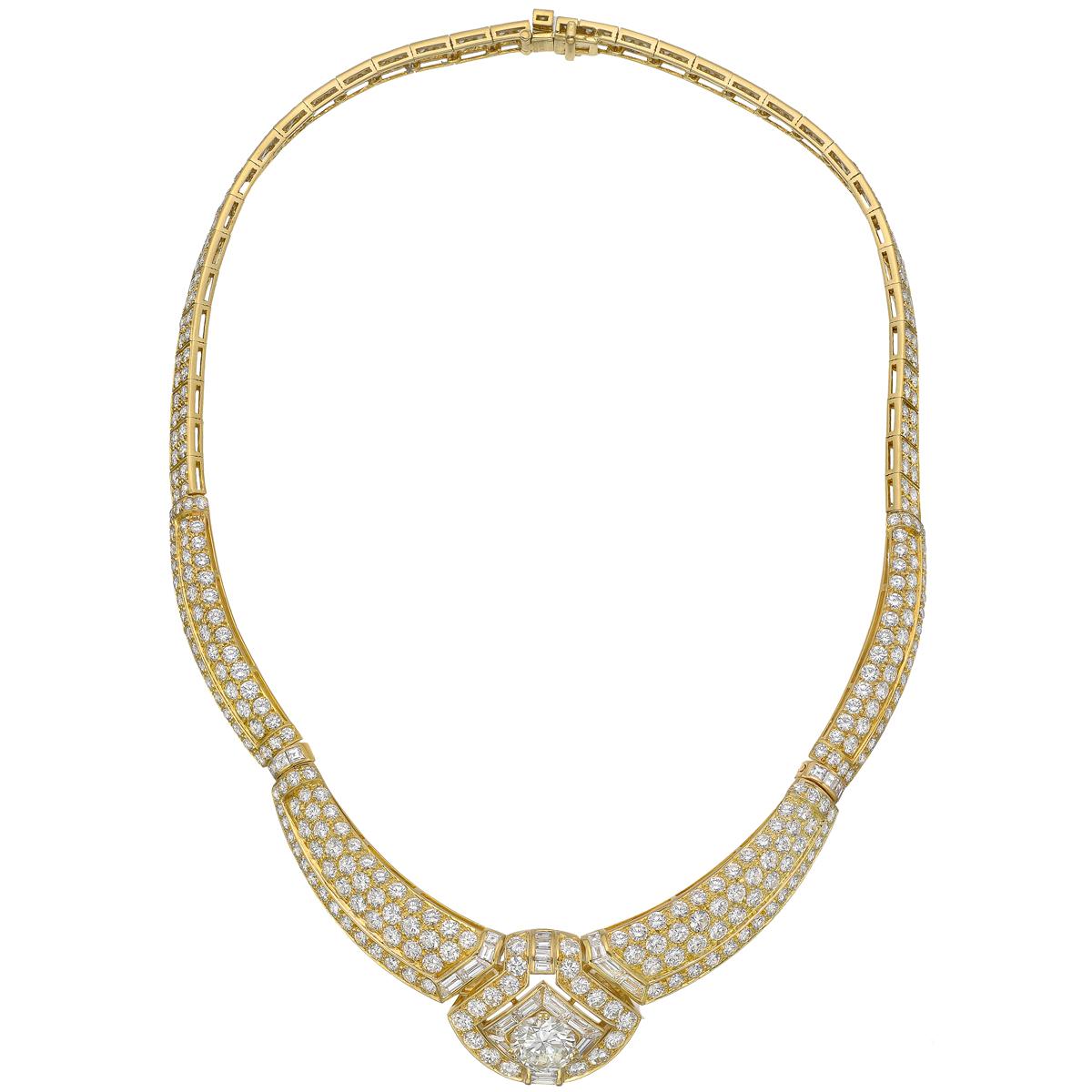 Vintage diamond collar necklace with matching doorknocker-style earrings, featuring fine round and baguette-cut diamonds, set in 18k yellow gold, the necklace and earrings with French hallmarks and maker's marks, the necklace signed