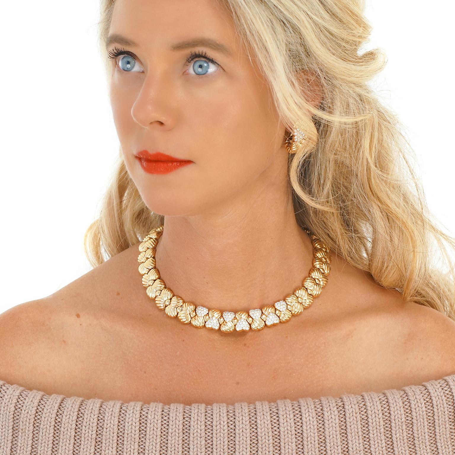 Circa 1970s, 18k, by Boucheron, Paris, France. This ultra-chic diamond-set yellow gold necklace by the storied house of Boucheron features an understated heart motif. The look is vintage sixties French jewelry at its fashionable Parisian best. The