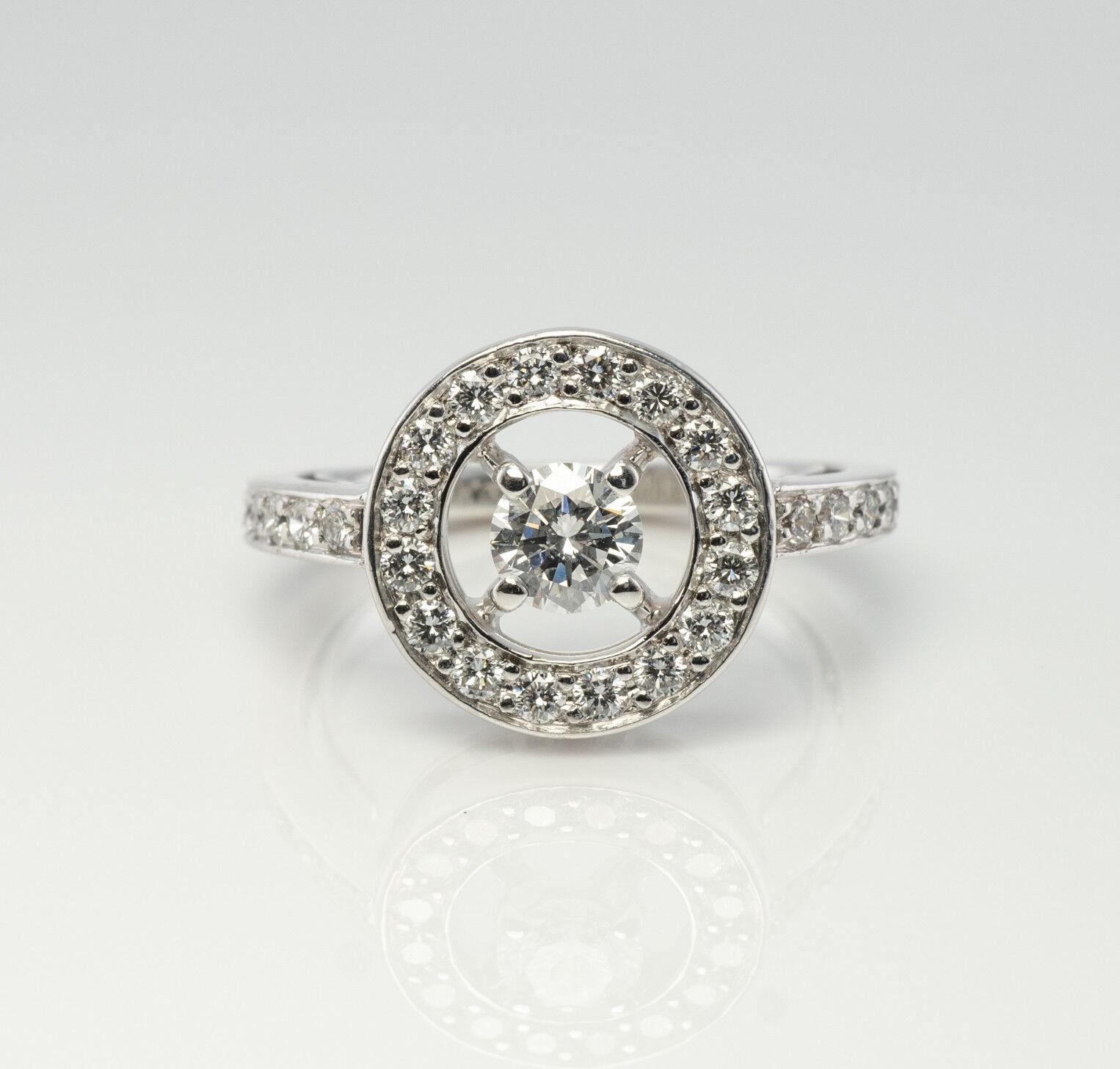 Authentic Boucheron Ring, Diamond Ring, solid 18K White Gold Ring, Circle Ring. The serial number is PRG29652, size 50, 15.92mm. The center round brilliant cut diamond is .25 carat, and thirty-four smaller diamonds add .51 carat to the total weight.