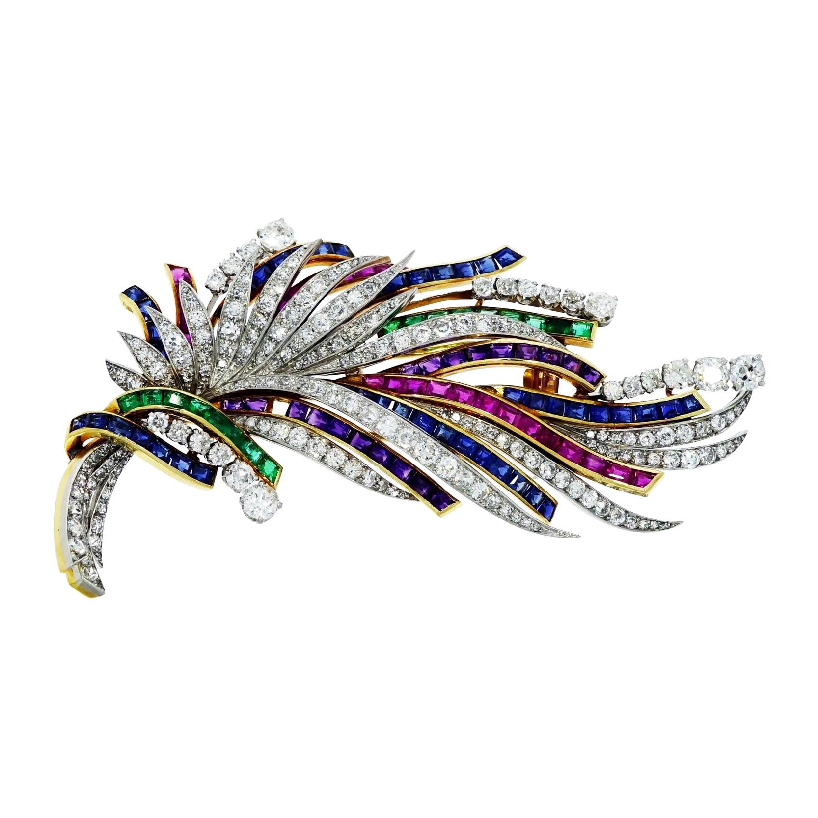 This Gorgeous ribbons and feathers like design vintage brooch... Handcrafted by Boucheron (Paris) in 18k Yellow and White Gold.
Decorated with princess cut sapphires, rubies, emeralds and amethyst mixed in with white round diamonds displaying lively
