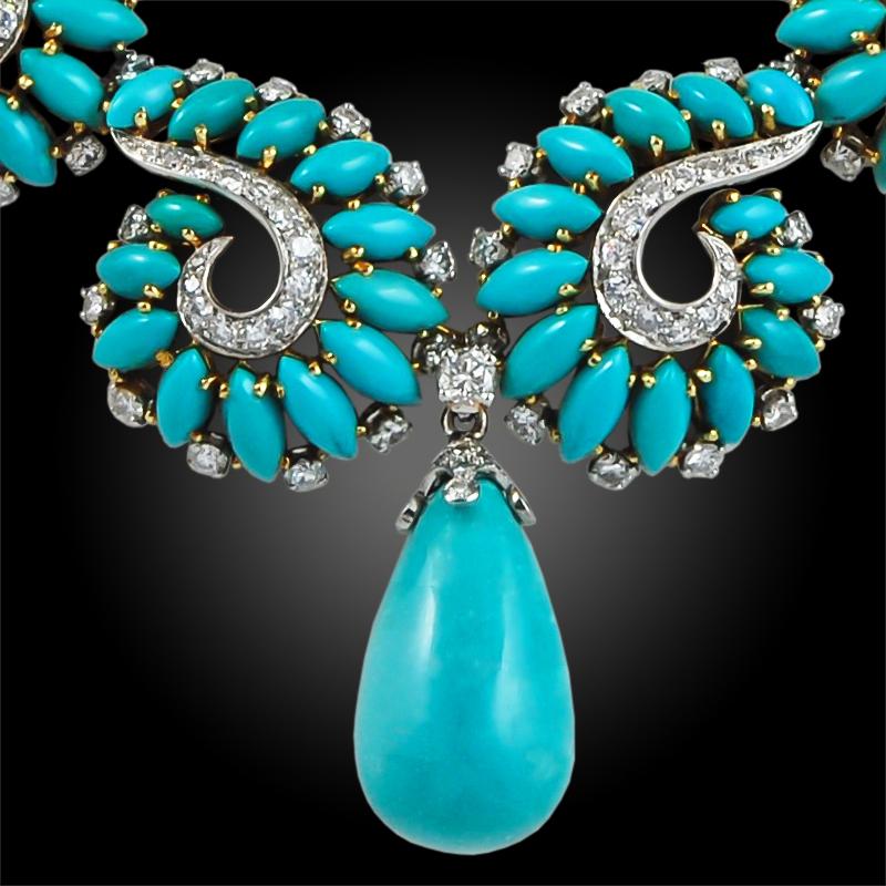 An extraordinary Boucheron necklace that dates back to the 1960s, featuring a large turquoise suspending drop surrounded by swirl motifs made of marquise cabochon turquoise and diamonds, finely crafted in 18k gold.
Signed Boucheron Paris.