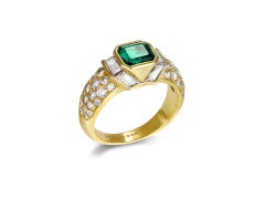 Boucheron emerald and diamond cluster ring, French, circa 1980.