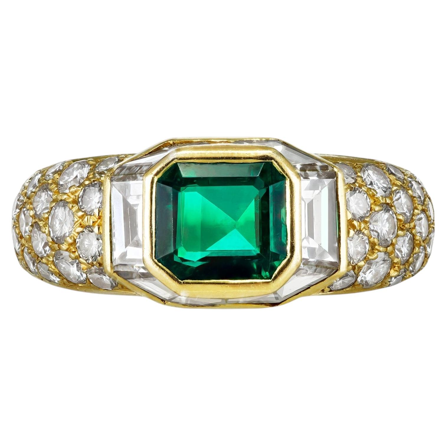 Boucheron emerald and diamond cluster ring, French, circa 1980.