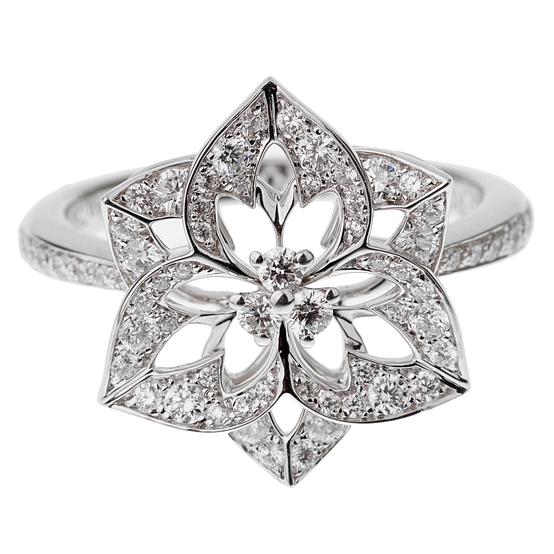 A chic Boucheron diamond ring showcasing a flower motif in shimmering 18k white gold, the ring is set with .57ct of the finest round brilliant cut vs diamonds. Size 6 1/4 and can be resized.