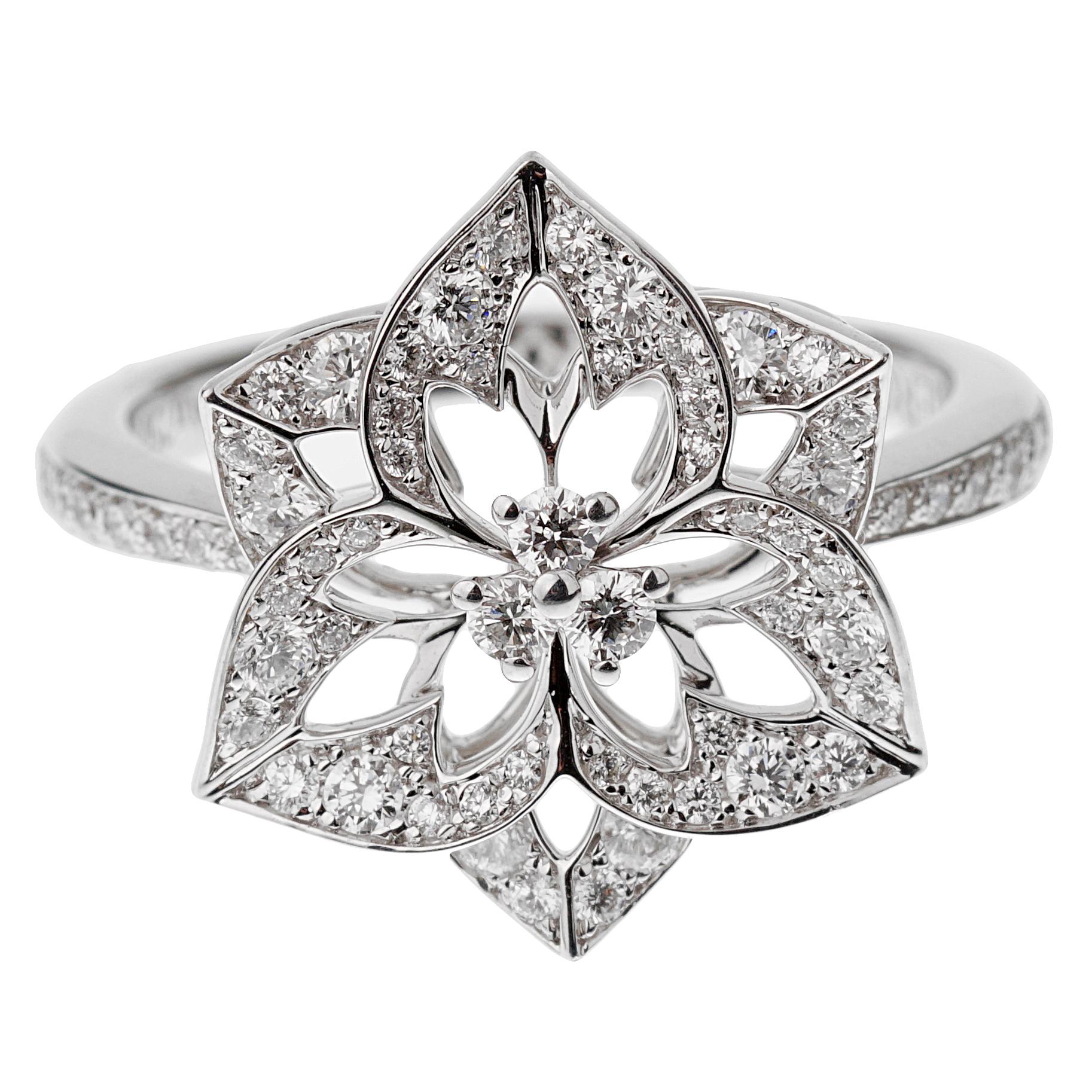 A chic Boucheron diamond ring showcasing a flower motif in shimmering 18k white gold, the ring is set with .57ct of the finest round brilliant cut vs diamonds. 

Size 6 1/4 and can be resized.

Sku 3091