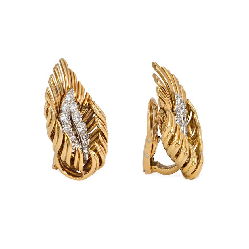 A pair of gold and diamond clip earrings in the form of stylized flames, in 18k.  André Vassort for Boucheron, Paris, #8560858.  Atw 0.60 ct. diamonds.  Approximately 1 1/8 inch long, 5/8 inch at widest