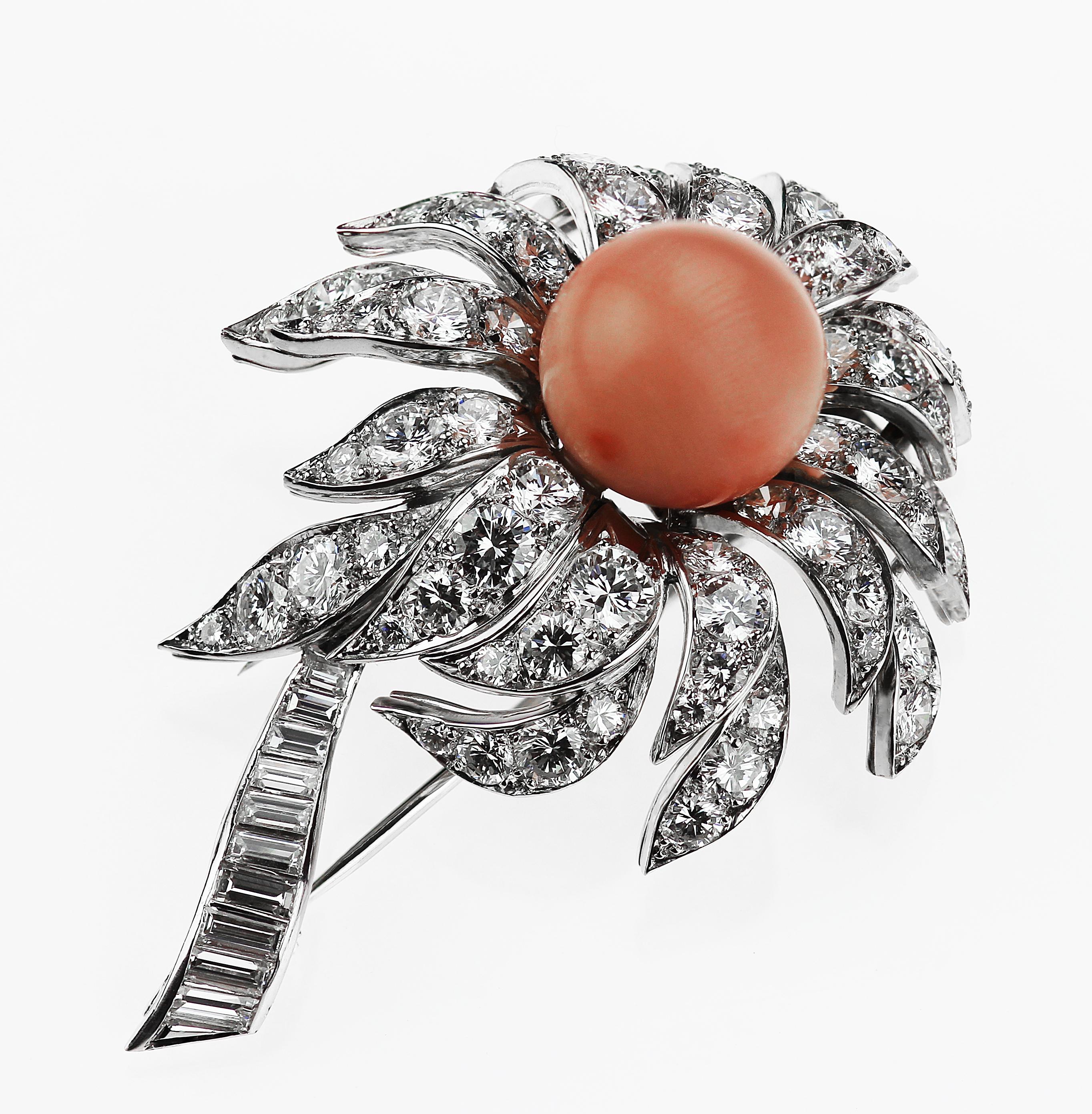 Stunning Boucheron 3D floral coral and diamond brooch, circa 1980's consisting of a divine pastel pink coral centre with lengthy explosive diamond petals and a stem of baguette cut diamonds set in platinum. 
Round brilliant and baguette cut