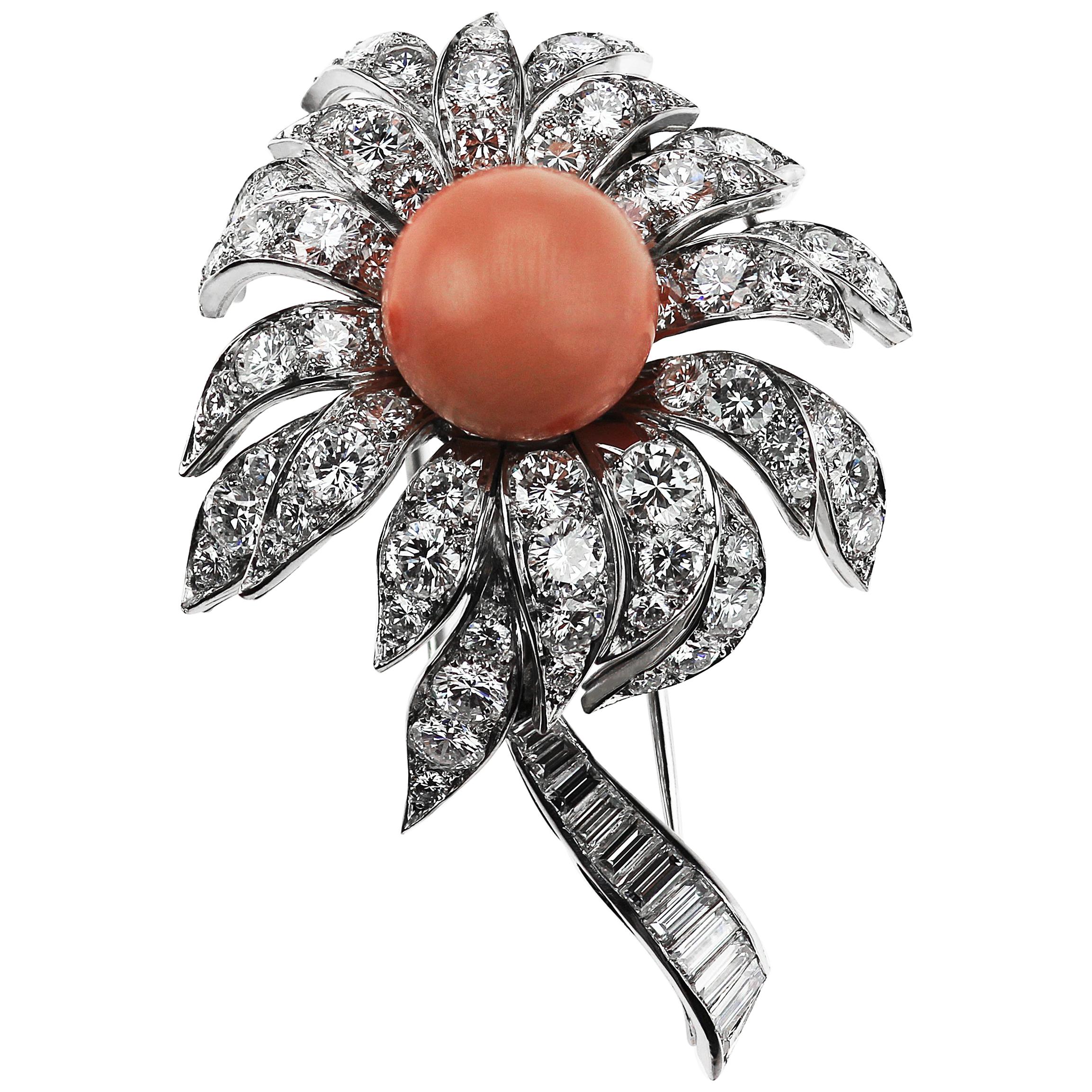 Stunning Boucheron 3D floral coral and diamond brooch, circa 1980's consisting of a divine pastel pink coral centre with lengthy explosive diamond petals and a stem of baguette cut diamonds set in platinum. 
Round brilliant and baguette cut