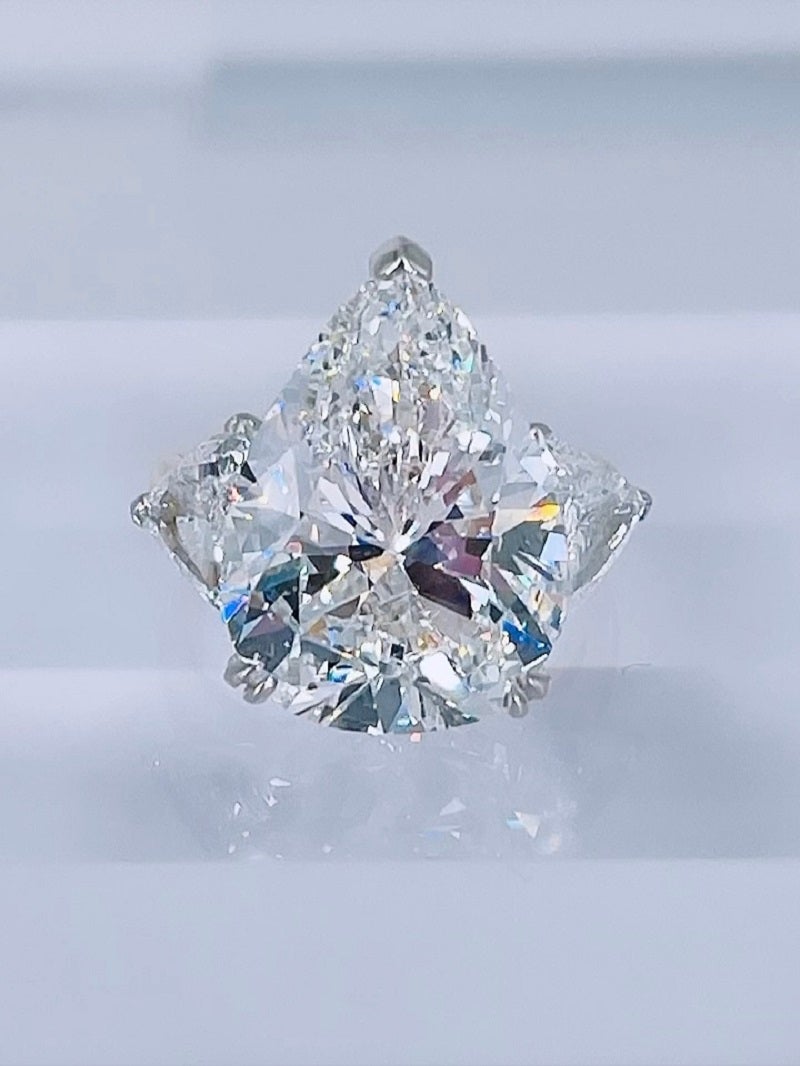 Boucheron GIA Certified 11.22 Carat G SI1 Pear Shape Diamond Three-Stone Ring For Sale