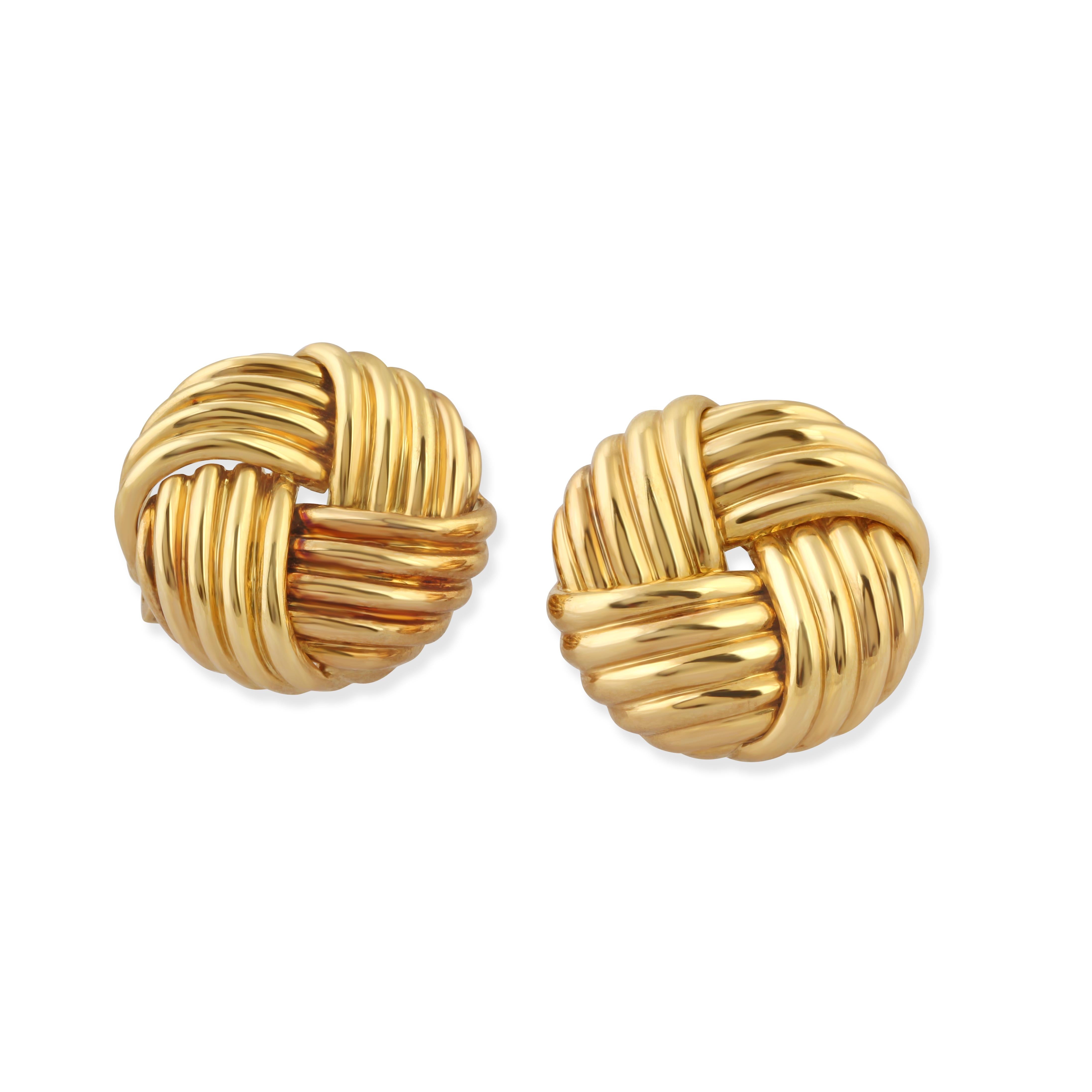 A pair of 18k gold knot earrings by Boucheron.