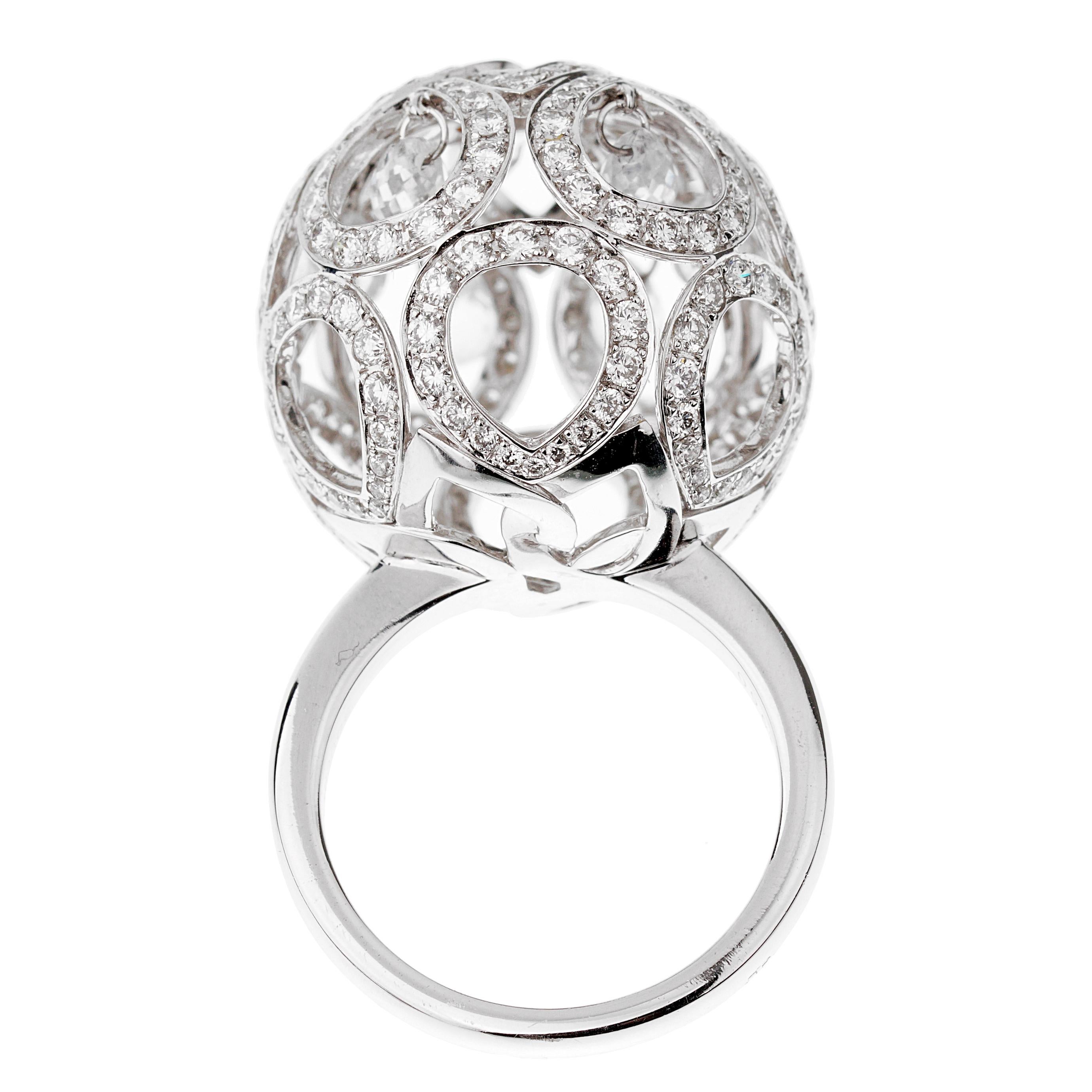 A magnificent Boucheron diamond cocktail ring showcasing an intricate design adorned with round brilliant cut diamonds. The inner sections have briolette white sapphires in shimmering 18k white gold. The diamonds measure 2.07ct and 2.90ct in