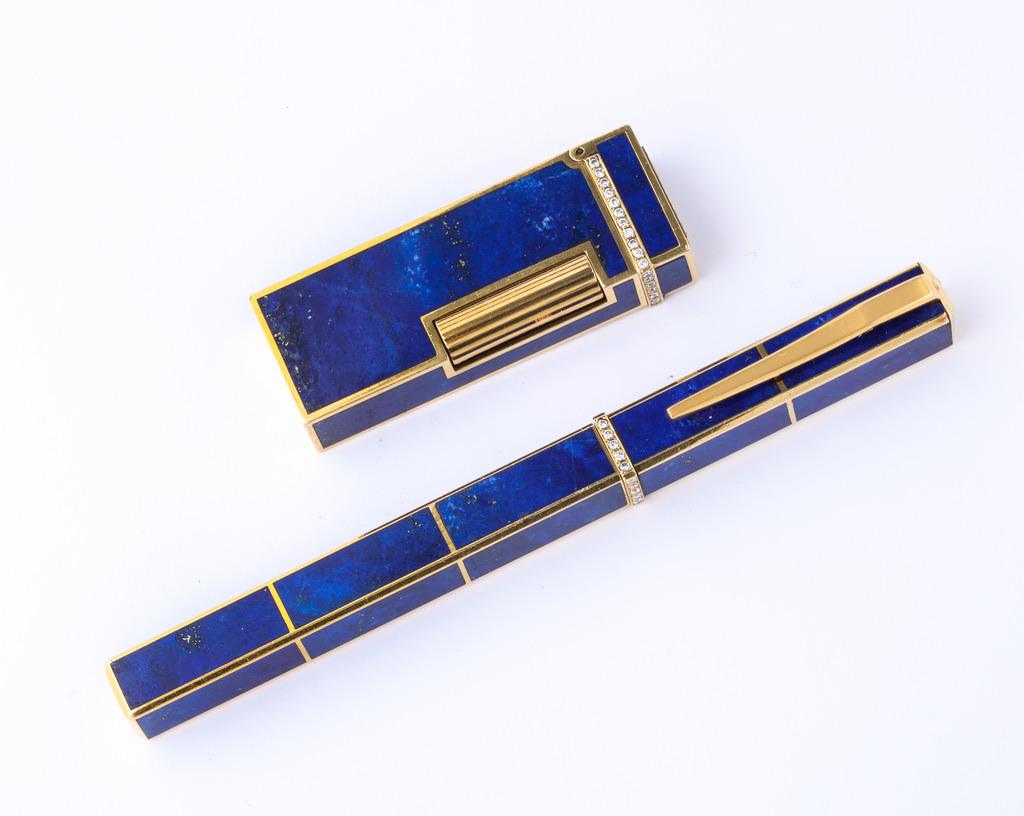 Rare matching set in solid 18kt yellow gold and lapis-lazuli comprised of a fountain pen and a lighter.  Made by in France by the prestigious jeweler Boucheron.
Signed, hallmarked and numbered for authenticity.
Complimentary overnight shipping is