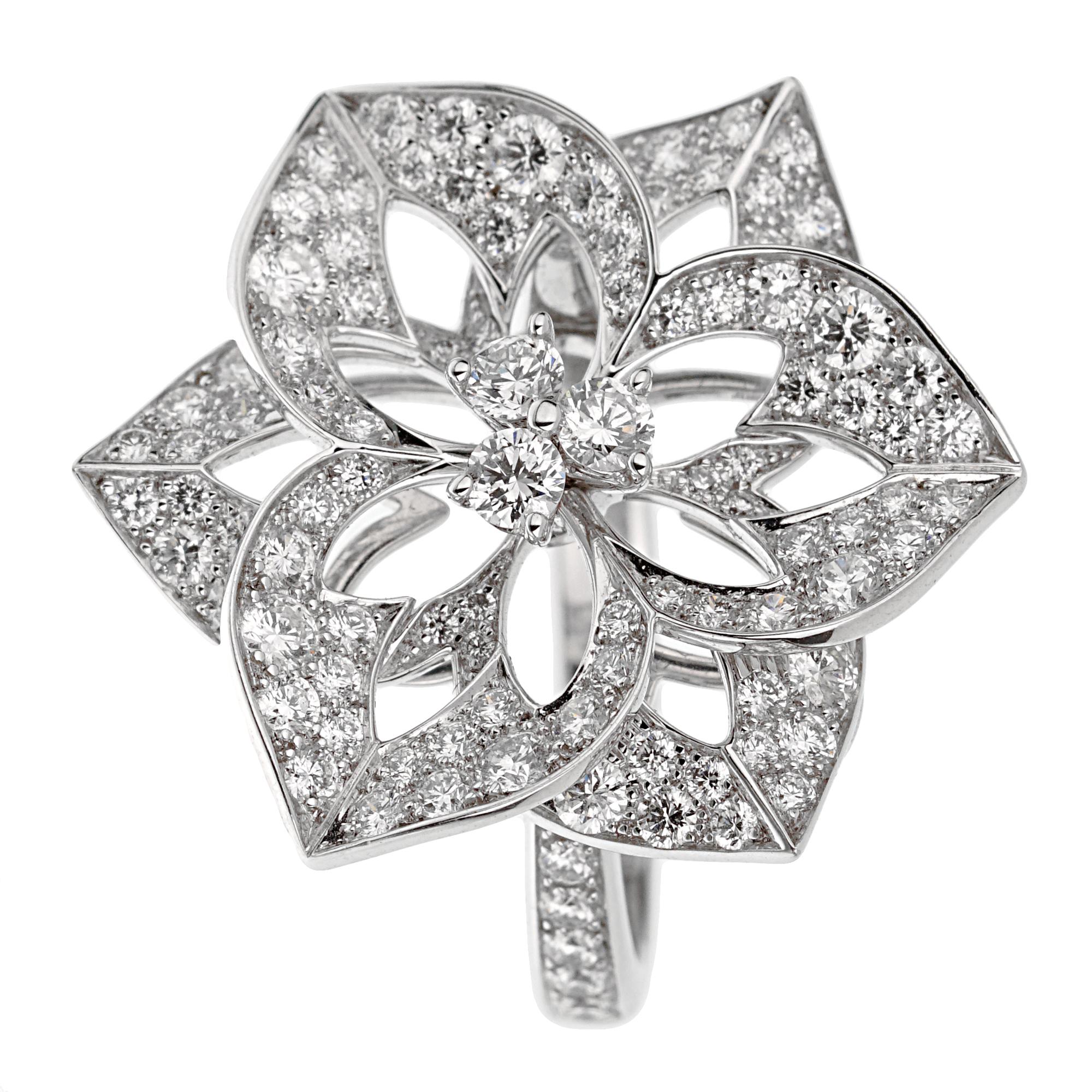 Crafted in luxurious 18k white gold, the ring showcases a stunning array of 1.55 carats of brilliant round-cut diamonds, meticulously set to create an enchanting floral pattern. The shimmering diamonds are radiating an unparalleled brilliance that