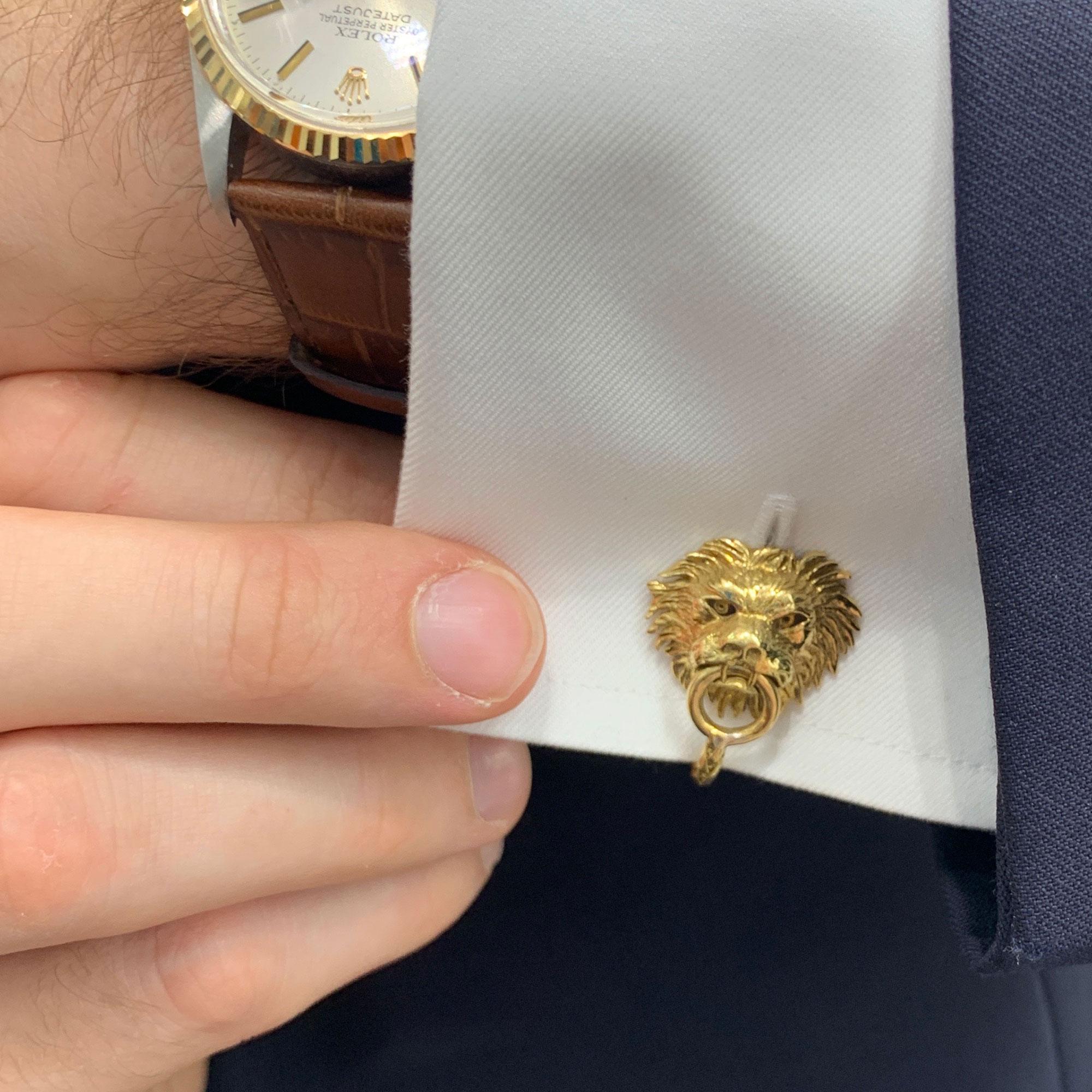 An exquisite and beautifully crafted pair of Boucheron 18ct yellow gold lion head door knocker cufflinks. 
The lions mouth holds the round door knocker which is linked to a woven rope which fits to a hook on the back. 
Gross weight 21.16 grams.