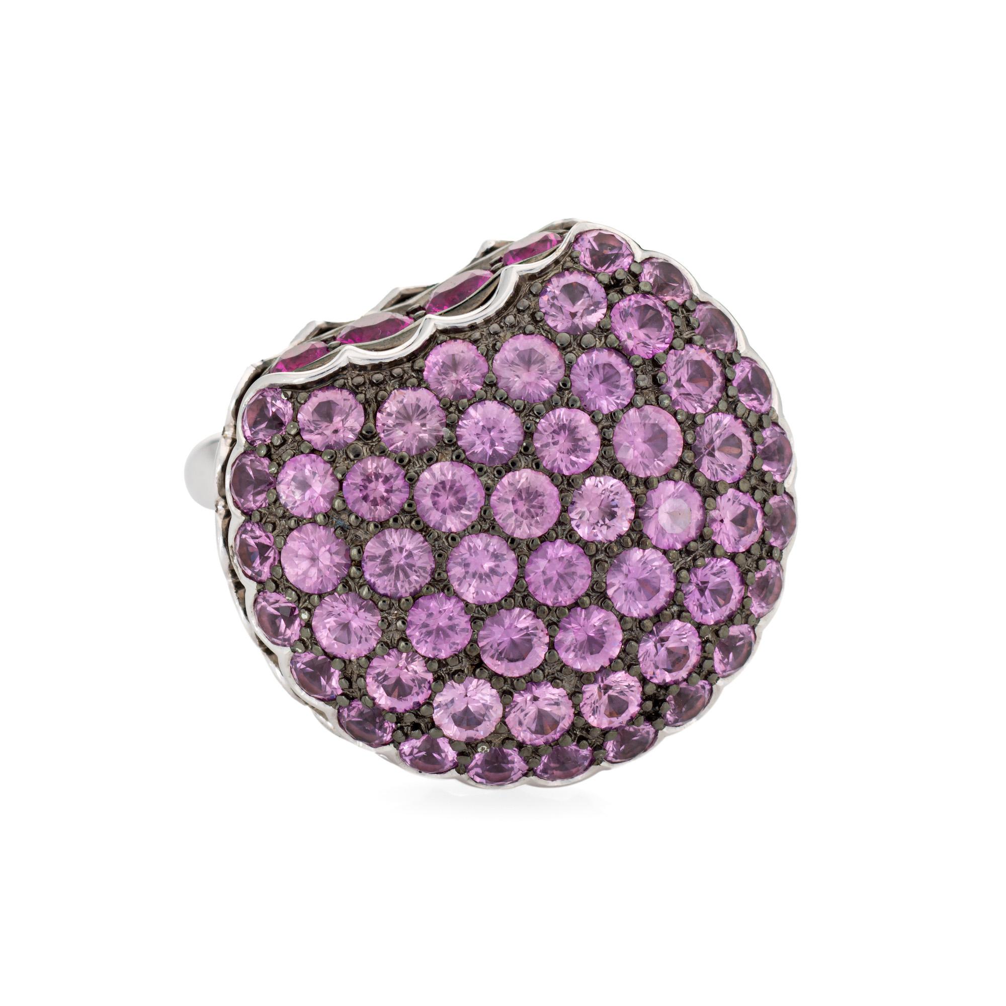 Estate Boucheron Macaroon ring crafted in 18k white gold.  

Pink sapphires are pave set into the mount, measuring approx. 2mm. Rubies measure approx. 2mm to 2.5mm. The gemstones are in very good condition and free of cracks or chips. 

Boucheron