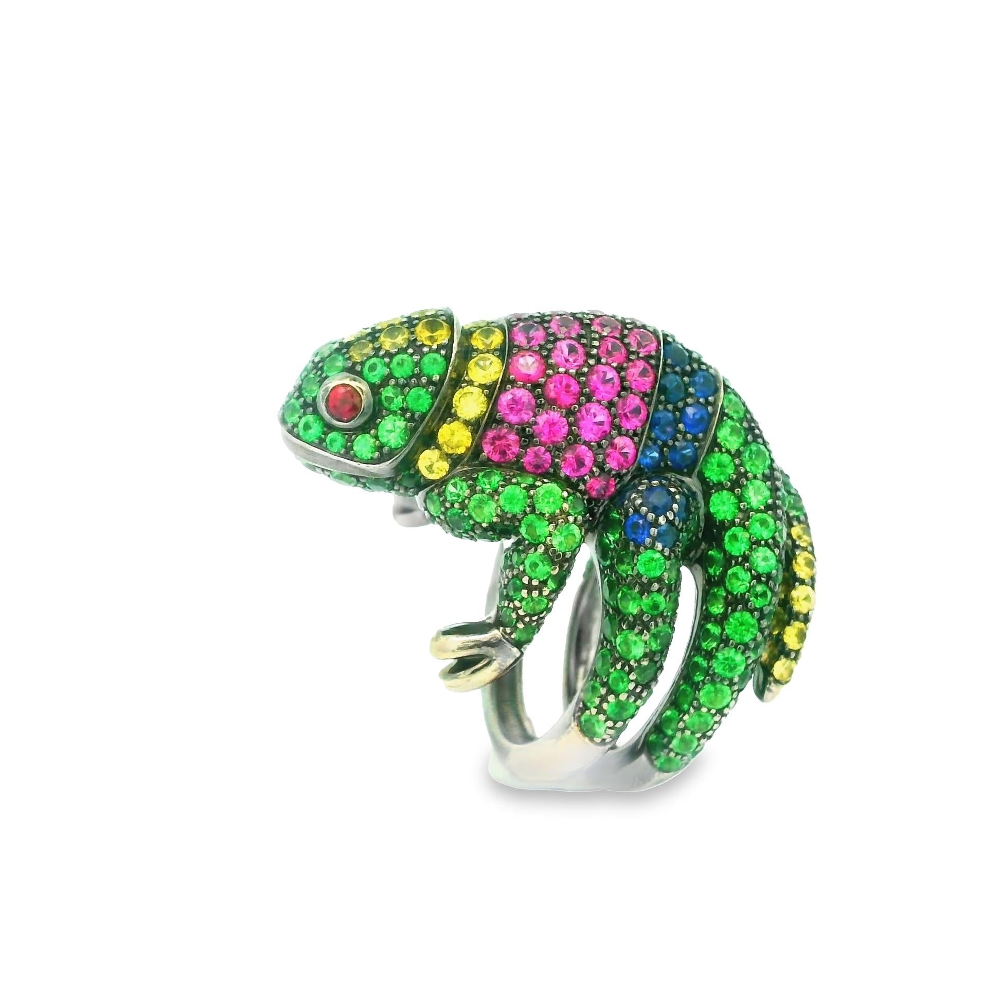 A rare and whimsical ring from Bucheron’s Animal Collection, this is Masy the Chameleon. It features an array of bright and vividly colored gemstones which include tsavorite, blue sapphire, yellow sapphire, pink sapphire, and ruby. Masy’s body is