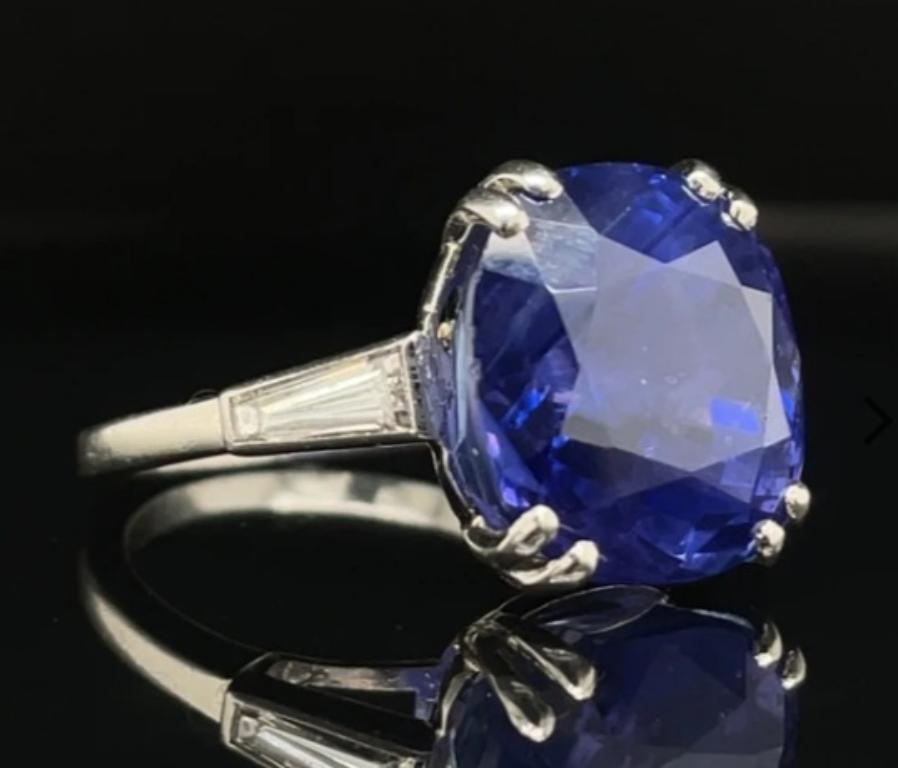 A Boucheron natural untreated 12.80 carat sapphire diamond ring set in platinum, circa 1950.

This truly exceptional ring is set to its centre with an impressive natural, untreated 12.80 carat cushion cut sapphire which is securely eight-claw set in