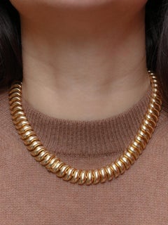 BOUCHERON Necklace Bracelet "Ondule" in yellow gold, 1940's