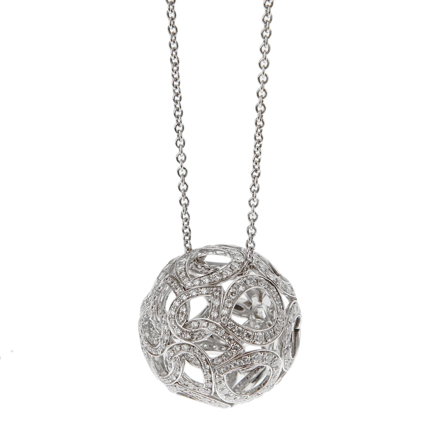 A fabulous Boucheron openwork necklace showcasing flower motifs in a circular globe adorned with 2.64ct of the finest original Boucheron round brilliant cut diamonds. The pendant is suspended by a Boucheron white gold necklace with 3 stations so it