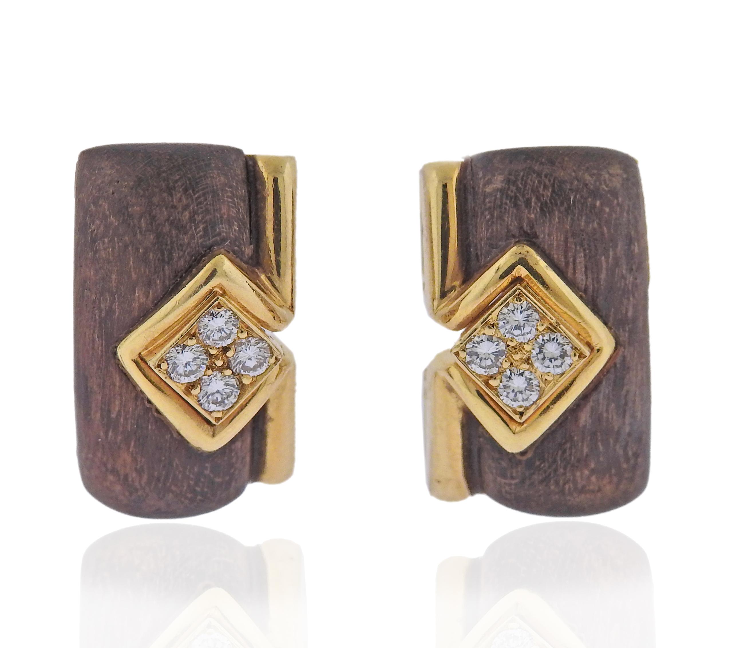 Pair of 18k gold Boucheron earrings with wood and approx. 0.40ctw G/VS diamonds. Measure 20 x 12mm. Weight 13.9 grams. Marked with Boucheron and French marks. 