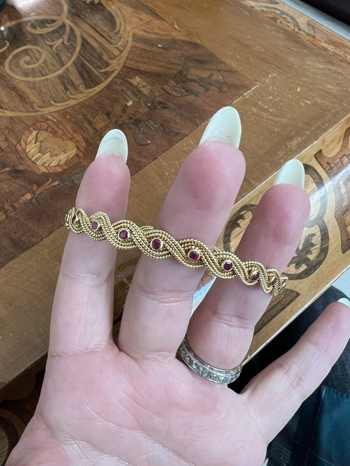 Boucheron Paris 18k Yellow Gold & Ruby Woven Bangle Bracelet Circa 1960s Vintage

Here is your chance to purchase a beautiful and highly collectible designer bangle bracelet.  

Vintage Boucheron Paris Woven 18k yellow gold & ruby bangle bracelet