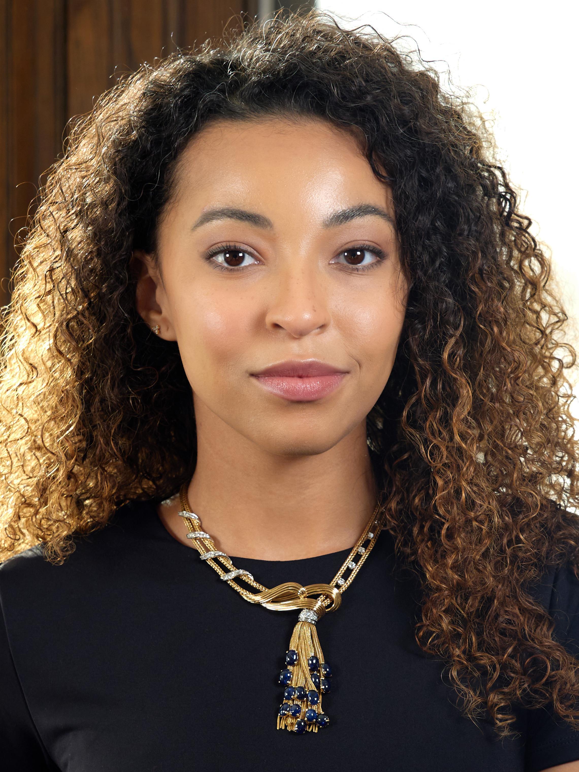 Designed as two strands of wheat chain with sweeping gold wire and platinum appliqué terminating with fringe tassel
Tassel is gathered with bands of platinum bead and channel set with old European and baguette cut diamonds
With additional old