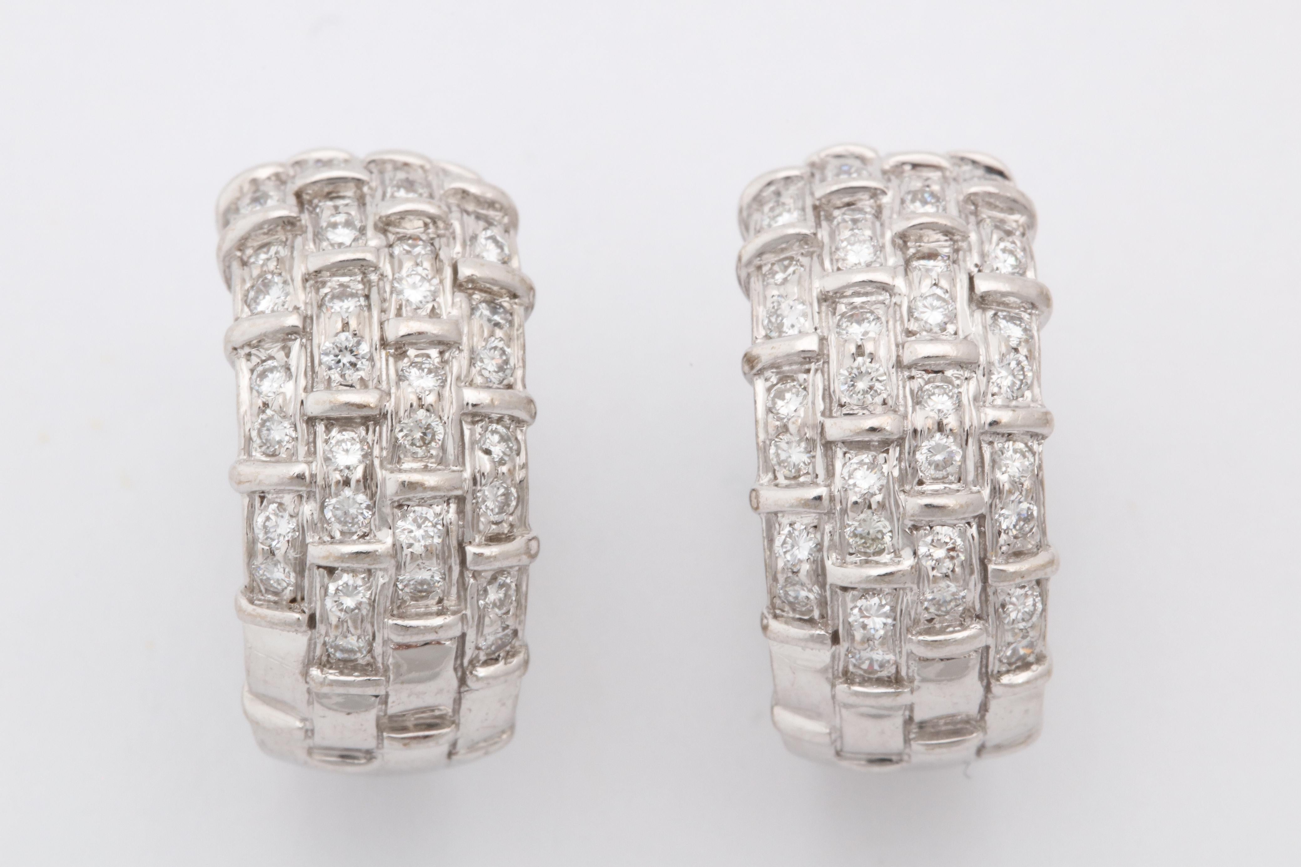 One Pair Of High Quality 18kt White Gold Half Hoop Earrings Created By Boucheron Paris. Each Earring Is Designed With Numerous High Quality Full Cut Diamonds Weighing Approximately [2] Carats Total Weight. Made In The 1980's In France. NOTE: Posts