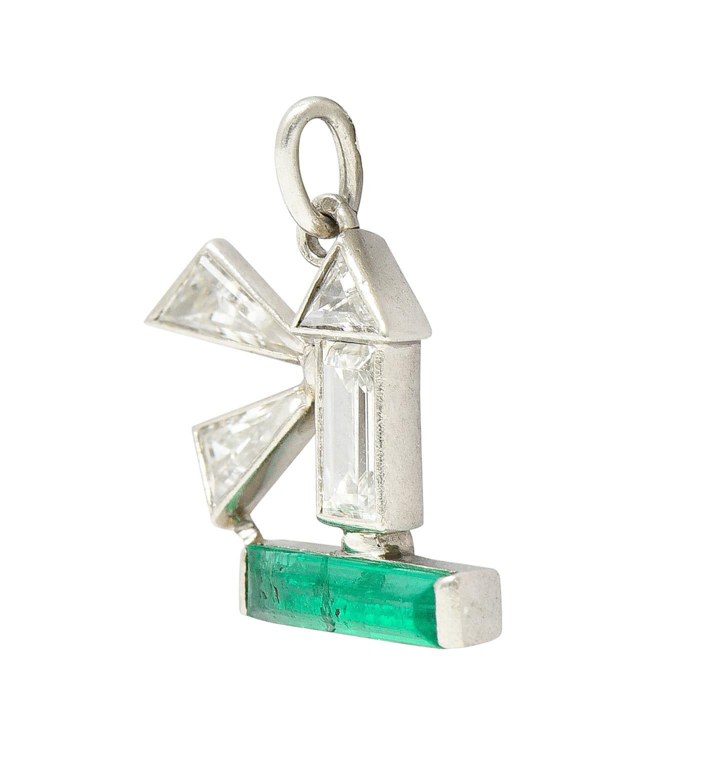 Designed as a stylized geometric lighthouse. With bezel set diamonds of varying cuts. Weighing approximately 0.40 carat total. Quality consistent with cut and age. With a bar set emerald baguette. Weighing approximately 0.20 carat total. Transparent