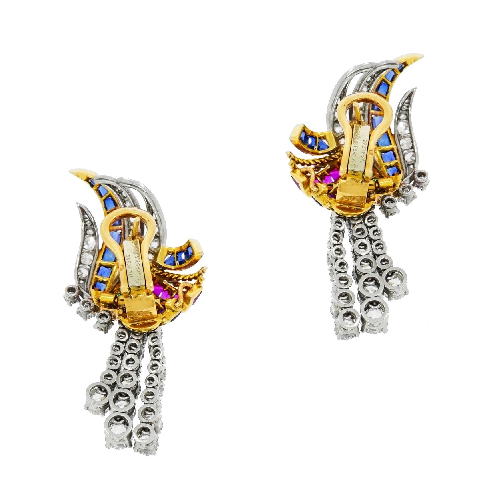 A truly gorgeous vintage drop earrings with vivid sapphires, rubies, amethyst and emeralds, reminiscent of ribbons and feathers that stands out beautifully against the bright white round diamonds set in white gold. The timeless design is glamorous,