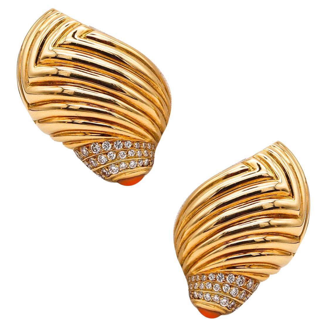 A pair of jeweled earrings designed by Boucheron.

A beautiful modernist pair of clips on earrings created in Paris, France by the house of Boucheron, back in the 1980. These pieces has been carefully crafted in the abstract shape of a seashell in