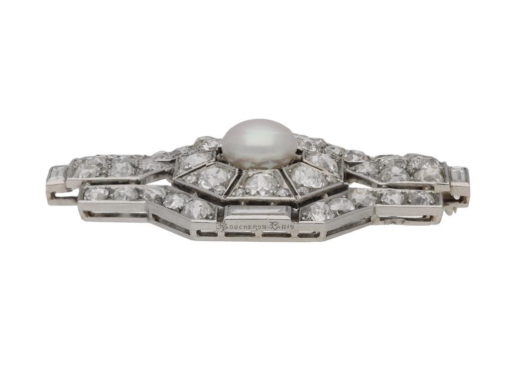 platinum brooch set with one central button shaped natural pearl with an approximate weight of 3.24 carats, set to a symmetrical geometric openwork body with central octagonal section set with eight cushion shaped old cut diamonds in bead settings