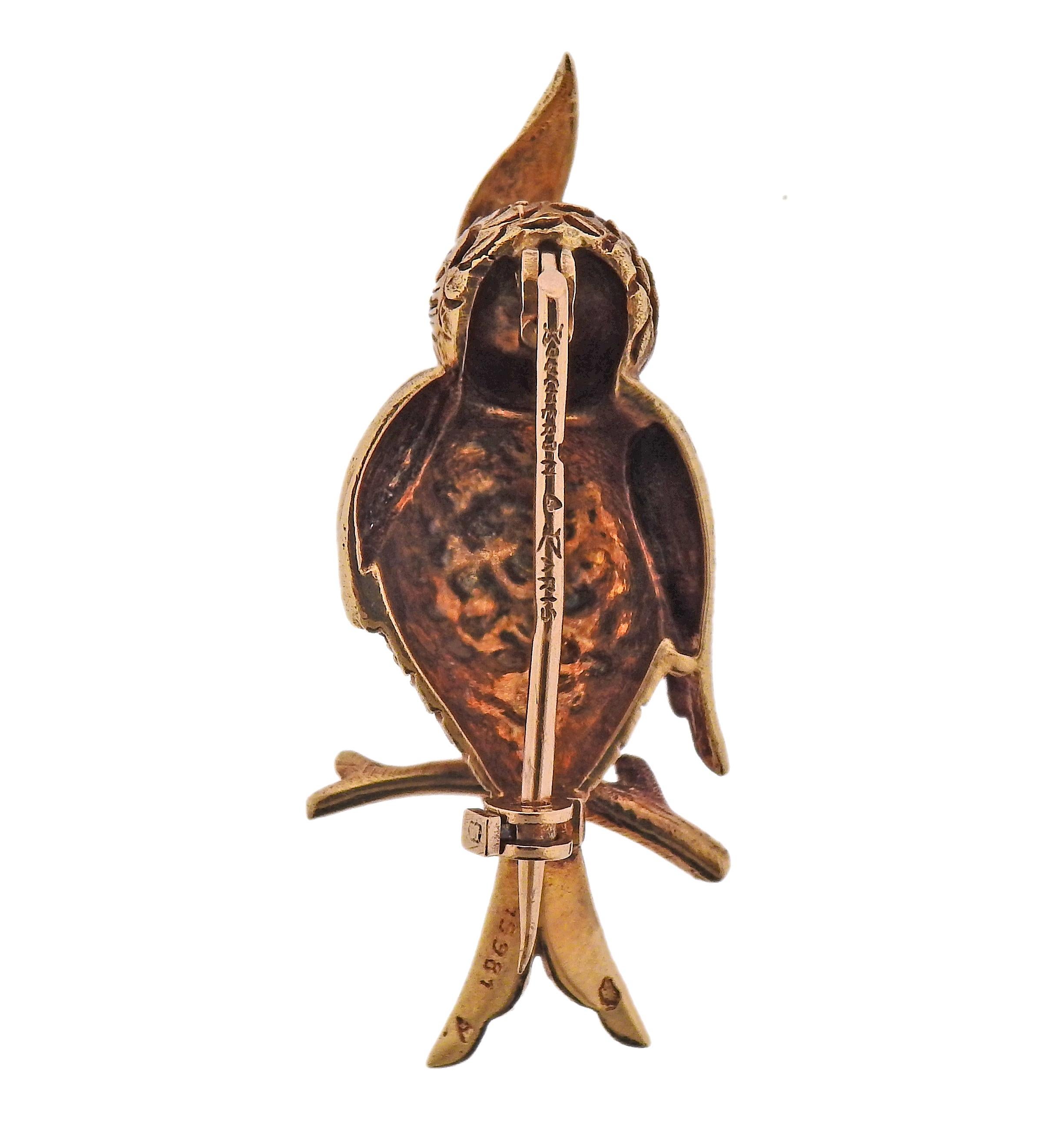 18k yellow gold owl brooch, by Boucheron Paris, with ruby eyes. Brooch is 40mm x 16mm. Marked: Boucheron Paris., 15981, French mark. Weight - 7.5 grams. 