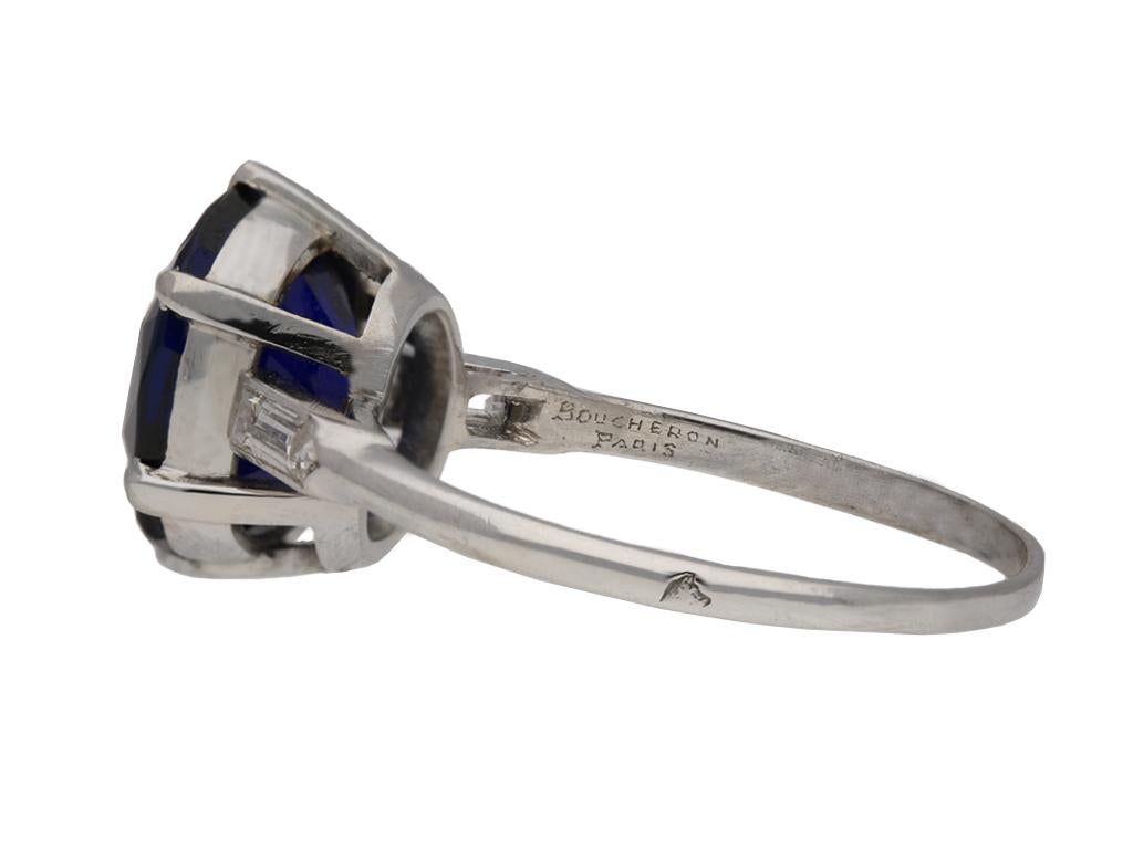 Boucheron Paris Burmese sapphire and diamond solitaire ring. Set to centre with a cushion shape old cut natural unenhanced Burmese sapphire in an open back claw setting with a weight of 4.02 carats, flanked by two rectangular baguette cut diamonds