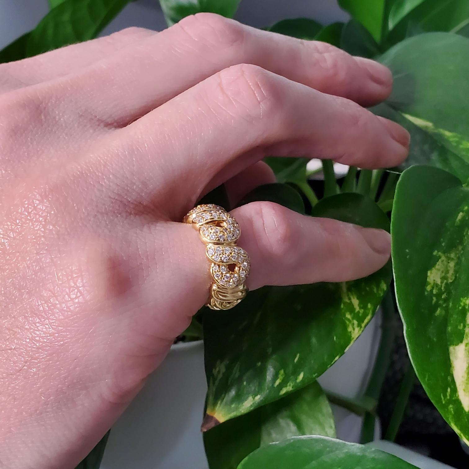 Jeweled eternity band ring designed by Boucheron.

Beautiful and elegant half-eternity, created in Paris, France by the house of Boucheron. It was crafted, with a nice wavy pattern in solid yellow gold of 18 karat with high polished