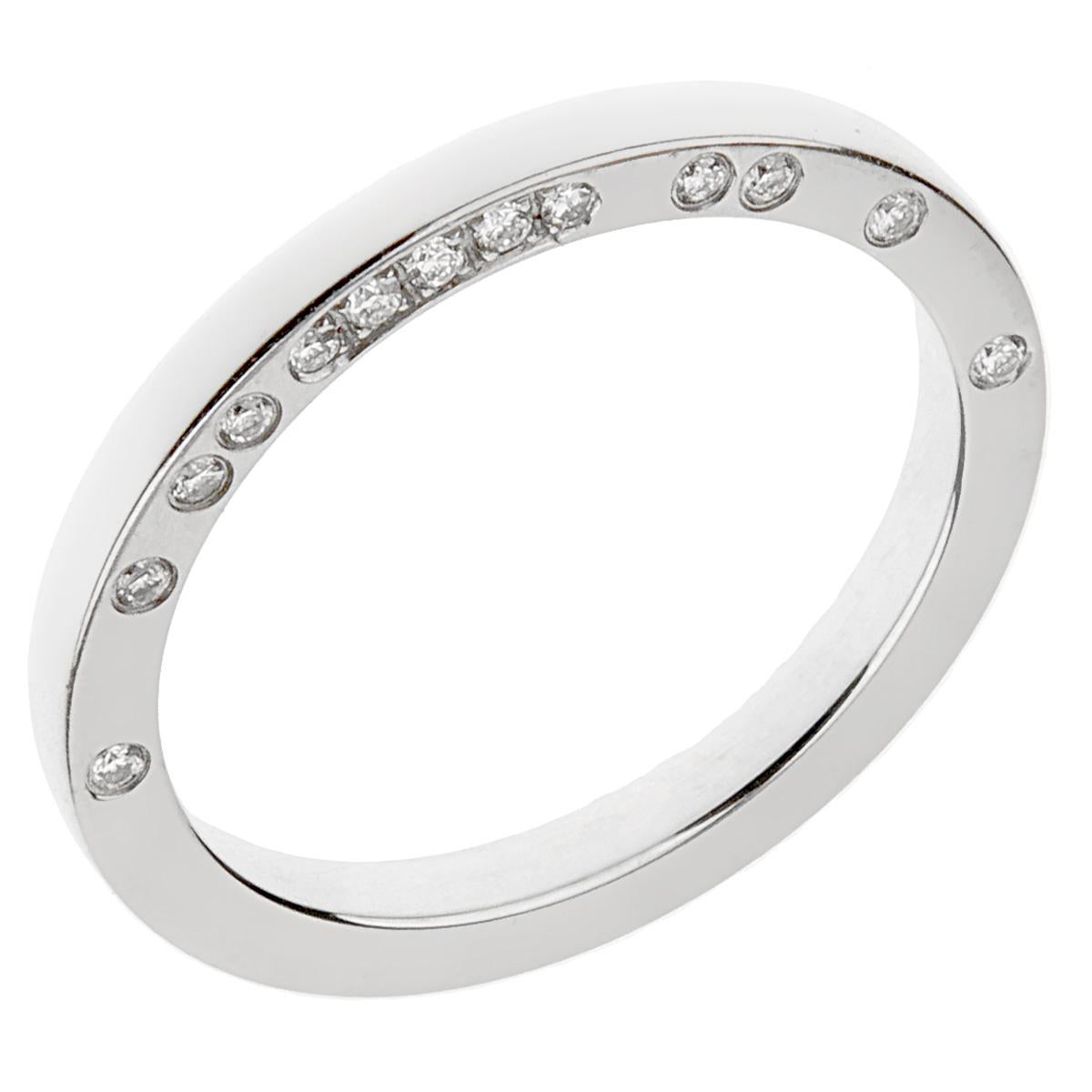 A chic Boucheron diamond band ring showcasing round brilliant cut diamonds set on the side of ring. The ring showcases 13 of the finest Boucheron round brilliant cut diamonds set in platinum. 

The ring measures a size eu 52 / us 5 3/4