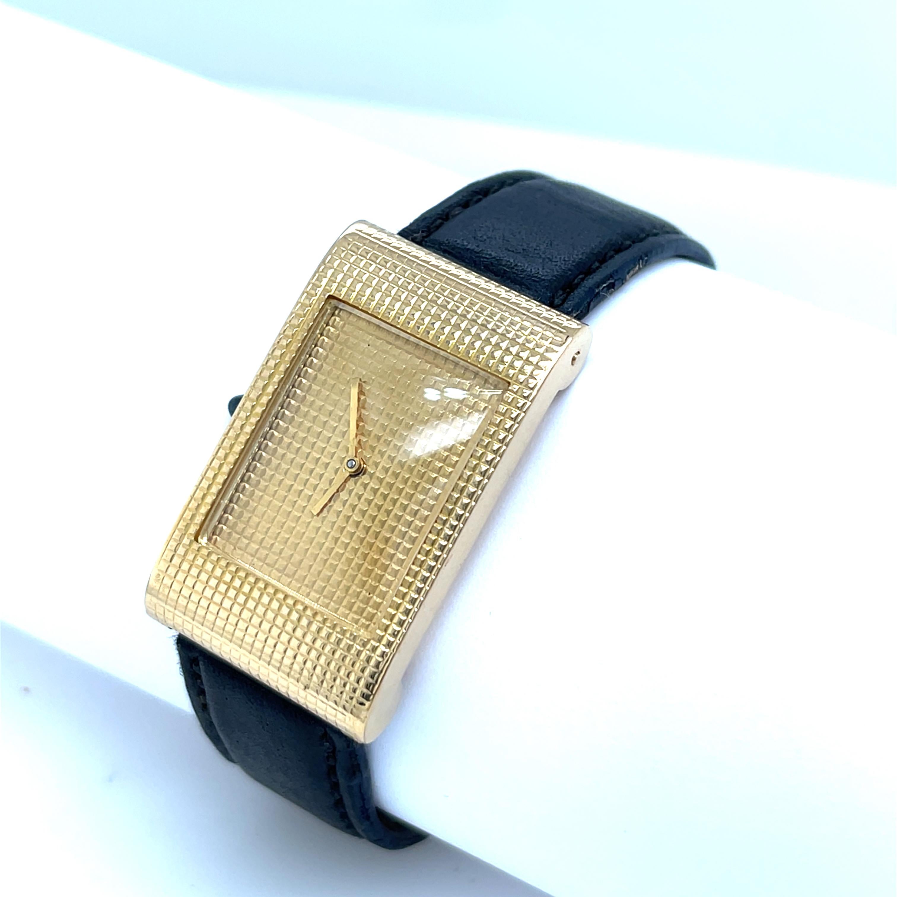 A stunning vintage Boucheron Reflet wristwatch, crafted in solid 18k yellow gold, featuring a gold-tone dial and the iconic Clous De Paris bezel. 
This elegant timepiece from the 1960s embodies timeless luxury and refined craftsmanship, making it a