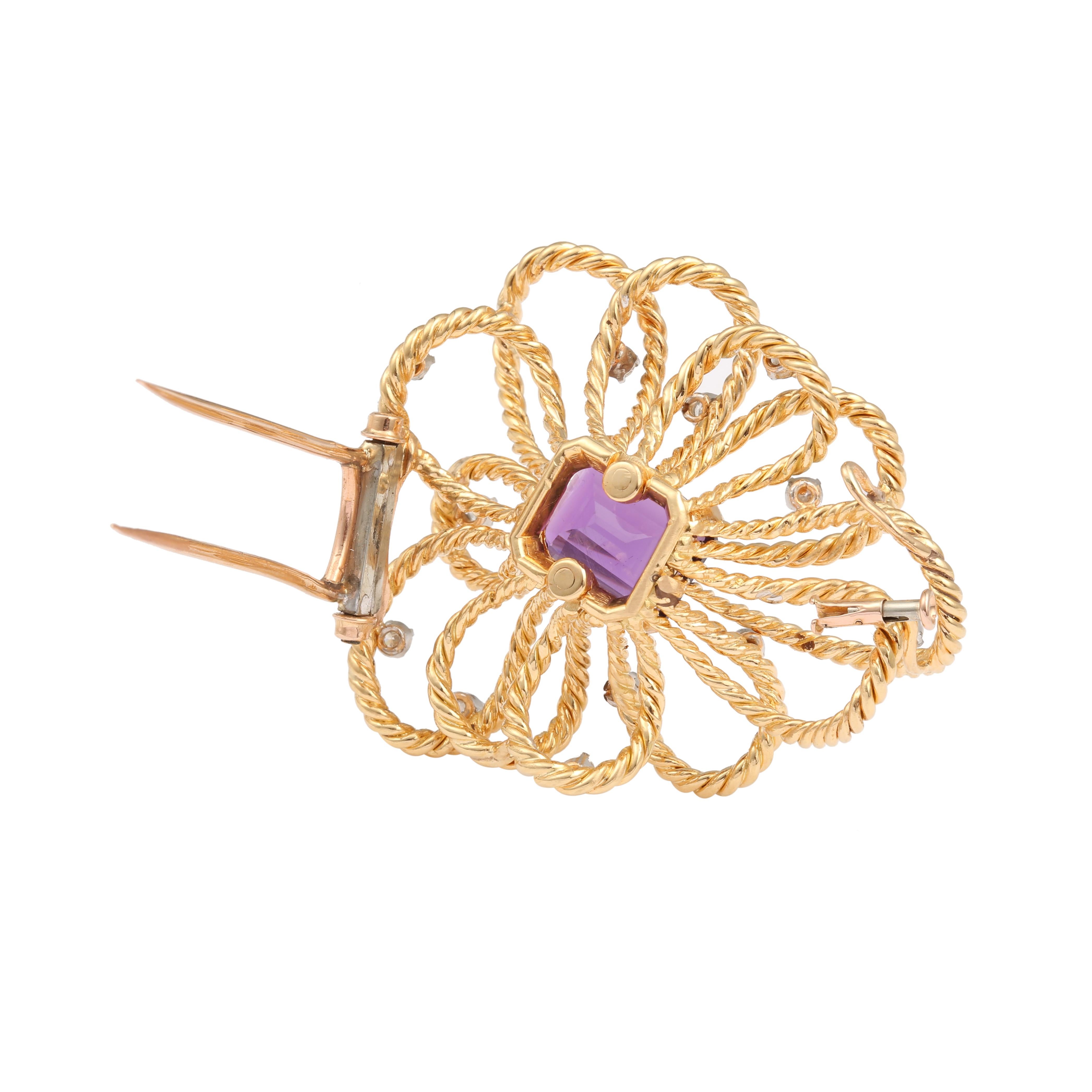 Magnificent flower brooch signed Boucheron set with a central emerald cut amethyst and 12 small round brilliant cut diamonds, mounted on twisted yellow gold.

Estimated weight of the central amethyst : 4.43 carats

Total estimated weight of
