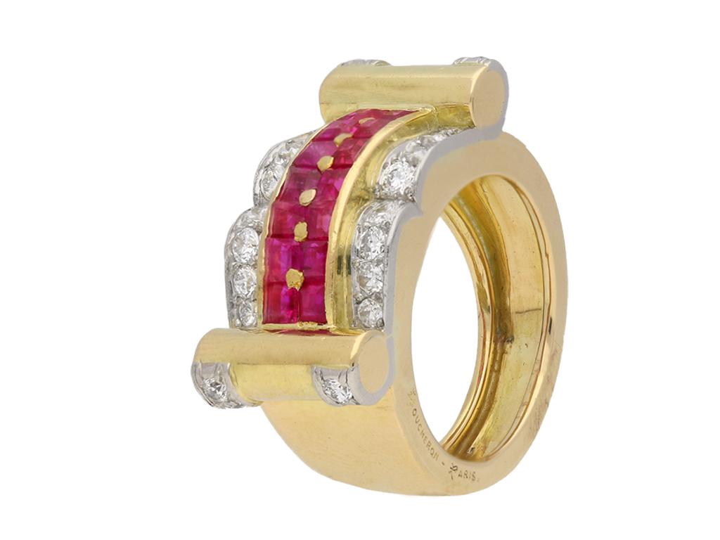 Boucheron ruby and diamond cocktail ring. Centrally set with two rows of square step cut natural unenhanced rubies in open back rubover and channel settings, fourteen in total with an approximate combined weight of 1.19 carats, horizontally framed