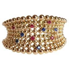 Boucheron Pulsera Semirrígida perlas en Oro Amarillo 18 Quilates Zafiros Rubíes