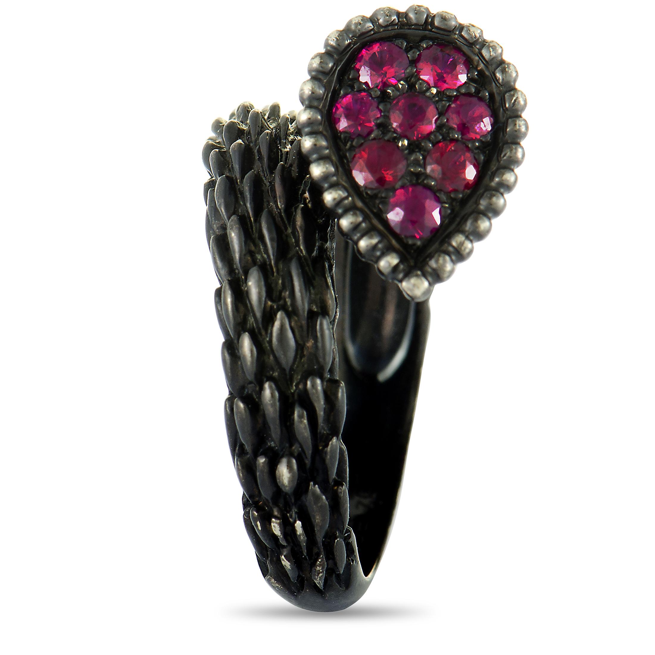 The Boucheron “Serpent Bohème” ring is crafted from black rhodium-plated 18K white gold and set with rubies. It weighs 8.2 grams, boasting band thickness of 3 mm and top height of 8 mm, while top dimensions measure 12 by 8 mm.

This item is