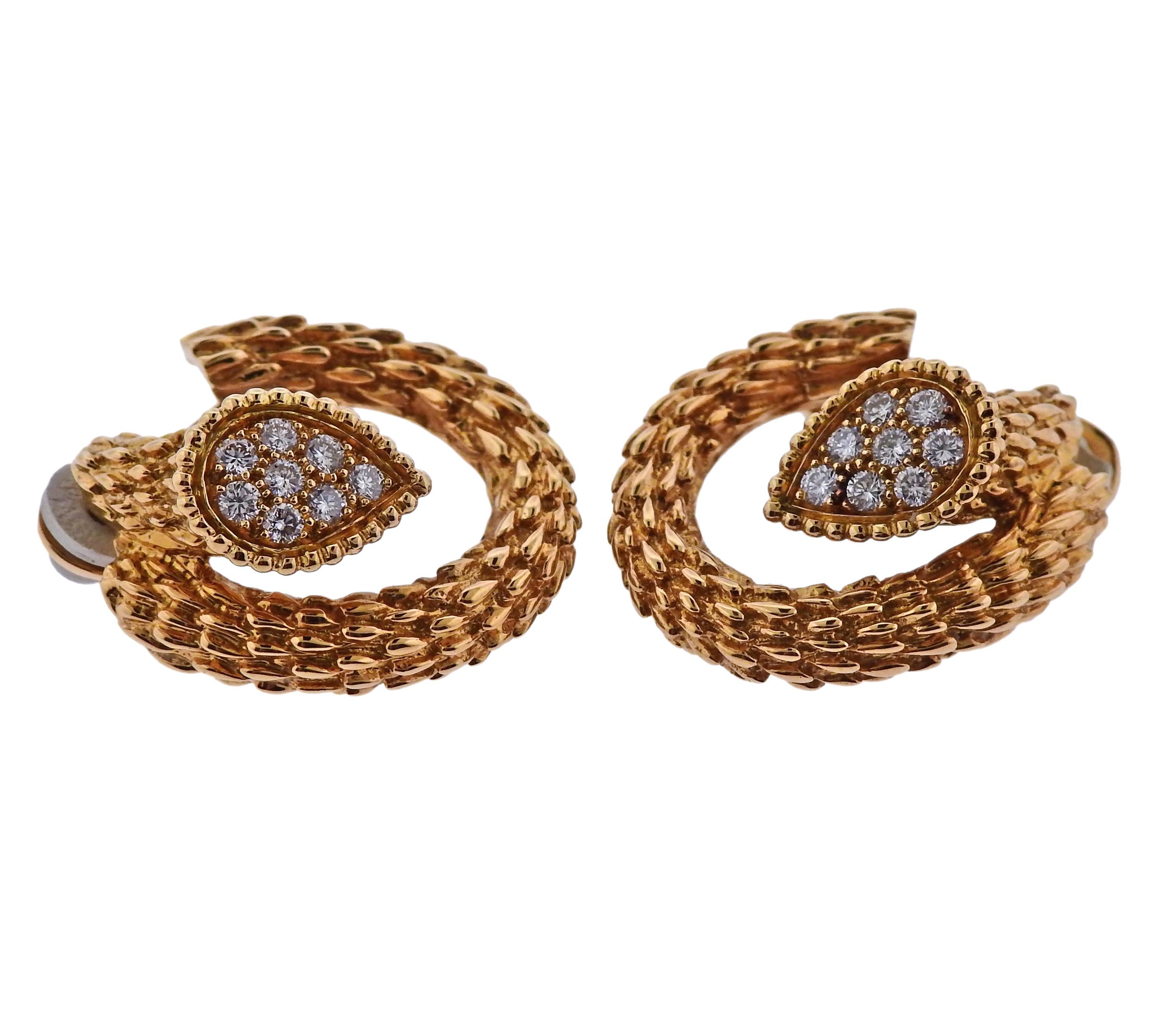 Pair of 18k yellow gold Serpent Boheme earrings, crafted by Boucheron, adorned with approx. 0.50ctw in diamonds. Earrings are 22mm x 22mm, weigh 18.2 grams. Marked: Boucheron, or750, A2991671.