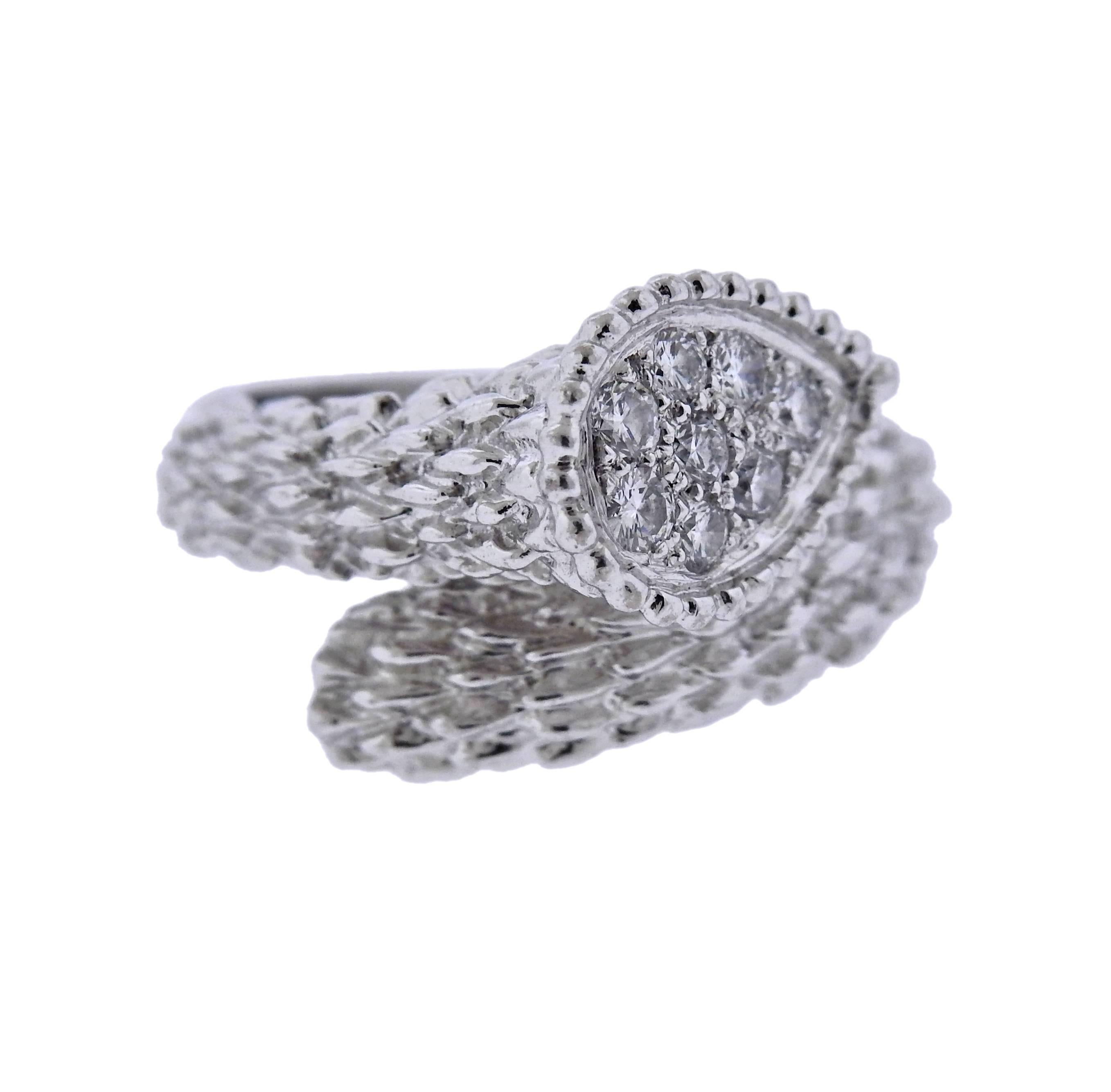 18k white gold Serpent Boheme ring, crafted by Boucheron, adorned with approx. 0.24ctw in diamonds. Ring size - 6.5, ring top is 14mm wide, weighs 7.9 grams. Marked: Boucheron, 52, E48096, 750. 
