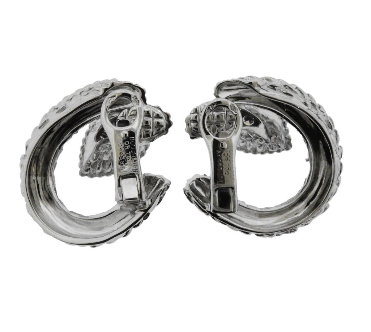Pair of 18k white gold earrings, crafted by Boucheron for Serpent Boheme collection, adorned with approx. 0.50ctw in G/VS diamonds.  Earrings are 24mm x 25mm, weigh 19.7 grams. Marked: Boucheron, or750, serial number.