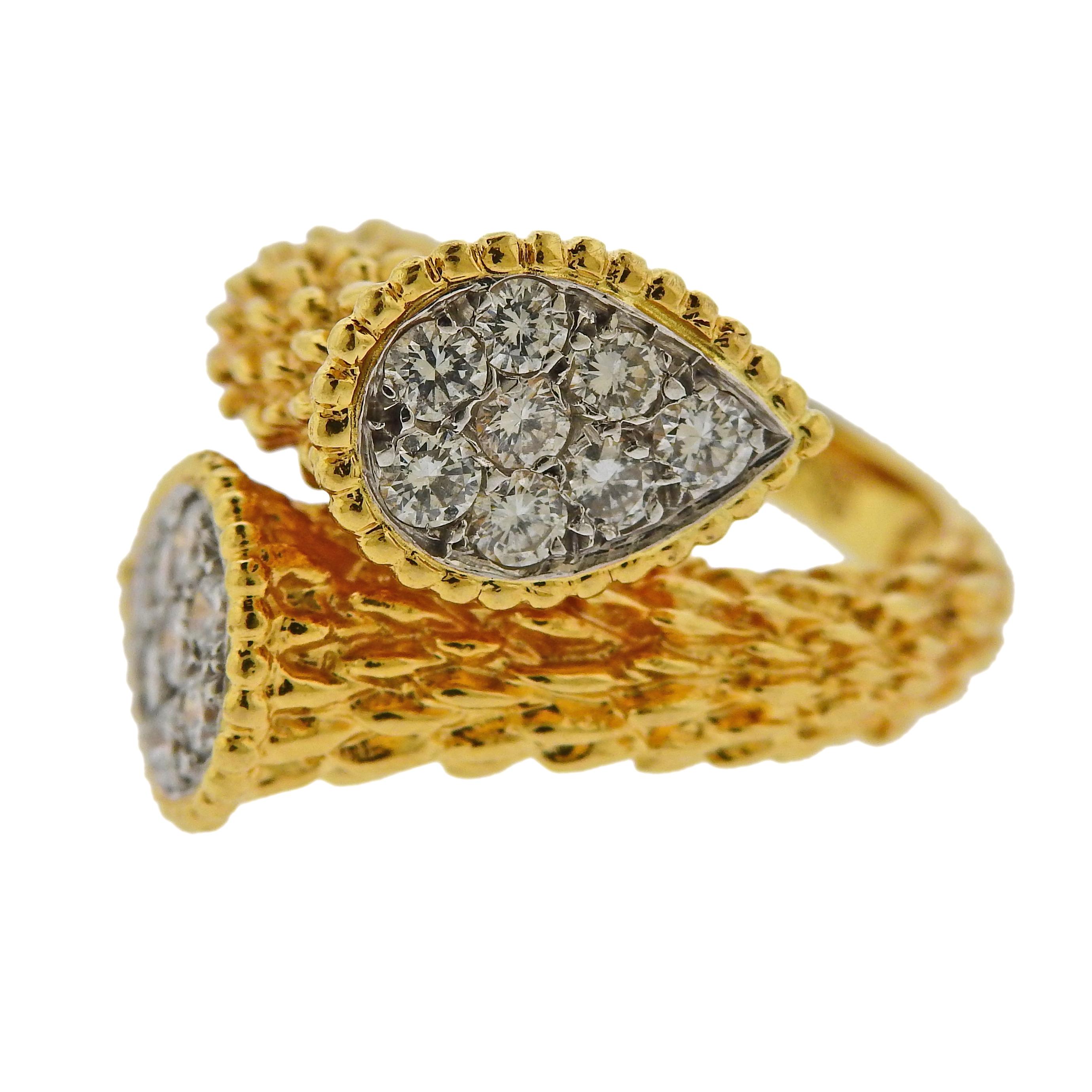 18k yellow gold Serpent Boheme ring by Boucheron, set with approx. 0.66ctw in G/VS diamonds, in 18k yellow gold. Ring size is 4.5, ring top measures 18mm wide. Weight is 11.3 grams. Marked: Boucheron, Maker's mark,  French eagle.