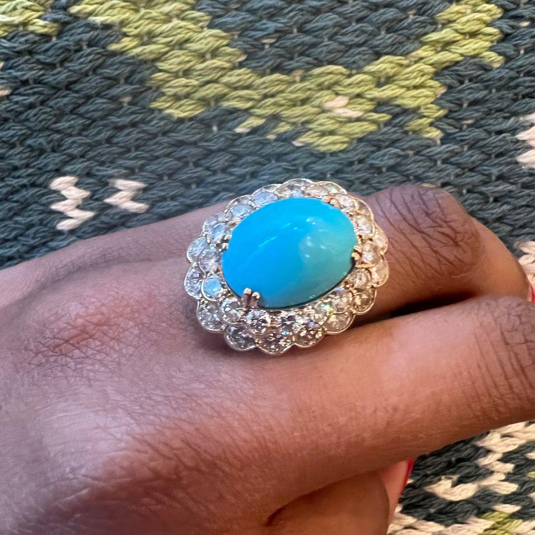 This elegant ring has 3.45 carats of diamonds, a central 8.95-carat turquoise and 18-karat yellow gold. Made by Boucheron. 
The ring is a size 5.5. It is signed by Boucheron Paris and numbered with the maker's mark. There is an inner sizing band