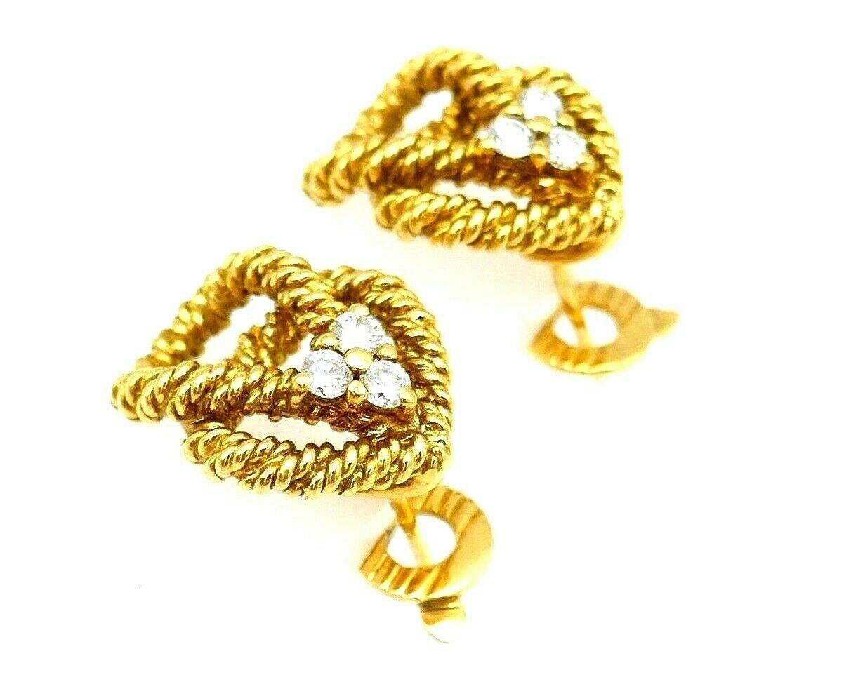 A pair of beautiful cable twist earrings by Boucheron. Made of 18k braided yellow gold featuring diamond. Stamped with Boucheron maker's mark, a French mark, a serial number and a hallmark for 18k gold.
Measurements: 3/4