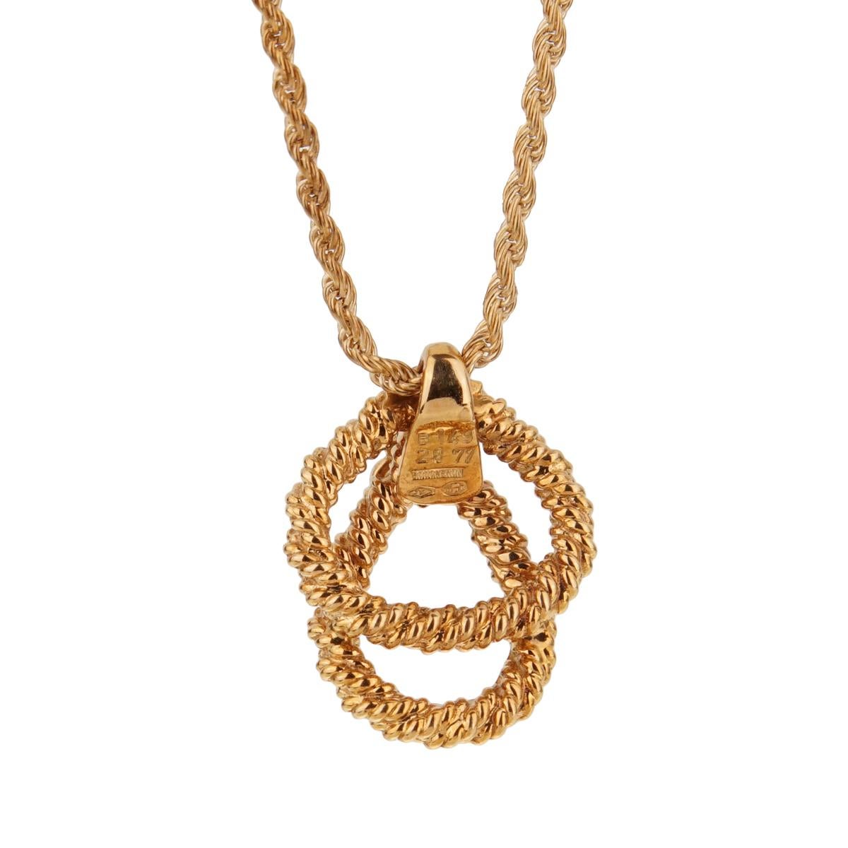 A magnificent Boucheron diamond pendant necklace featuring 3 round brilliant cut diamonds set in 18k yellow gold. The necklace is accompanied with a rope necklace by Boucheron.

Necklace length 17