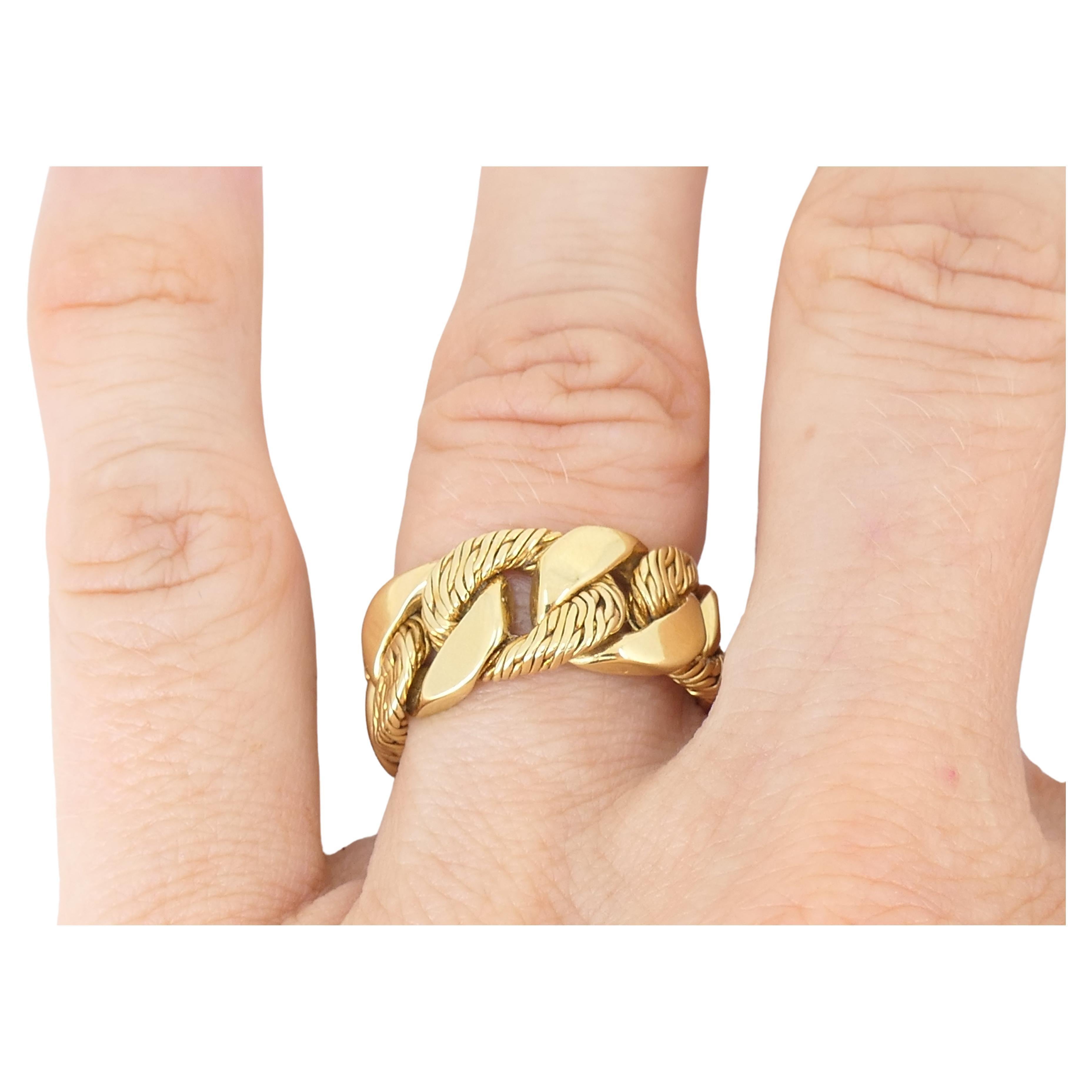 An amazing vintage gold ring by Boucheron designed as a curb-link chain wrapped around a finger. The links are crafted of textured and polished gold. A classic curblink design allows this 18k gold ring look substantial and chunky. Great workmanship