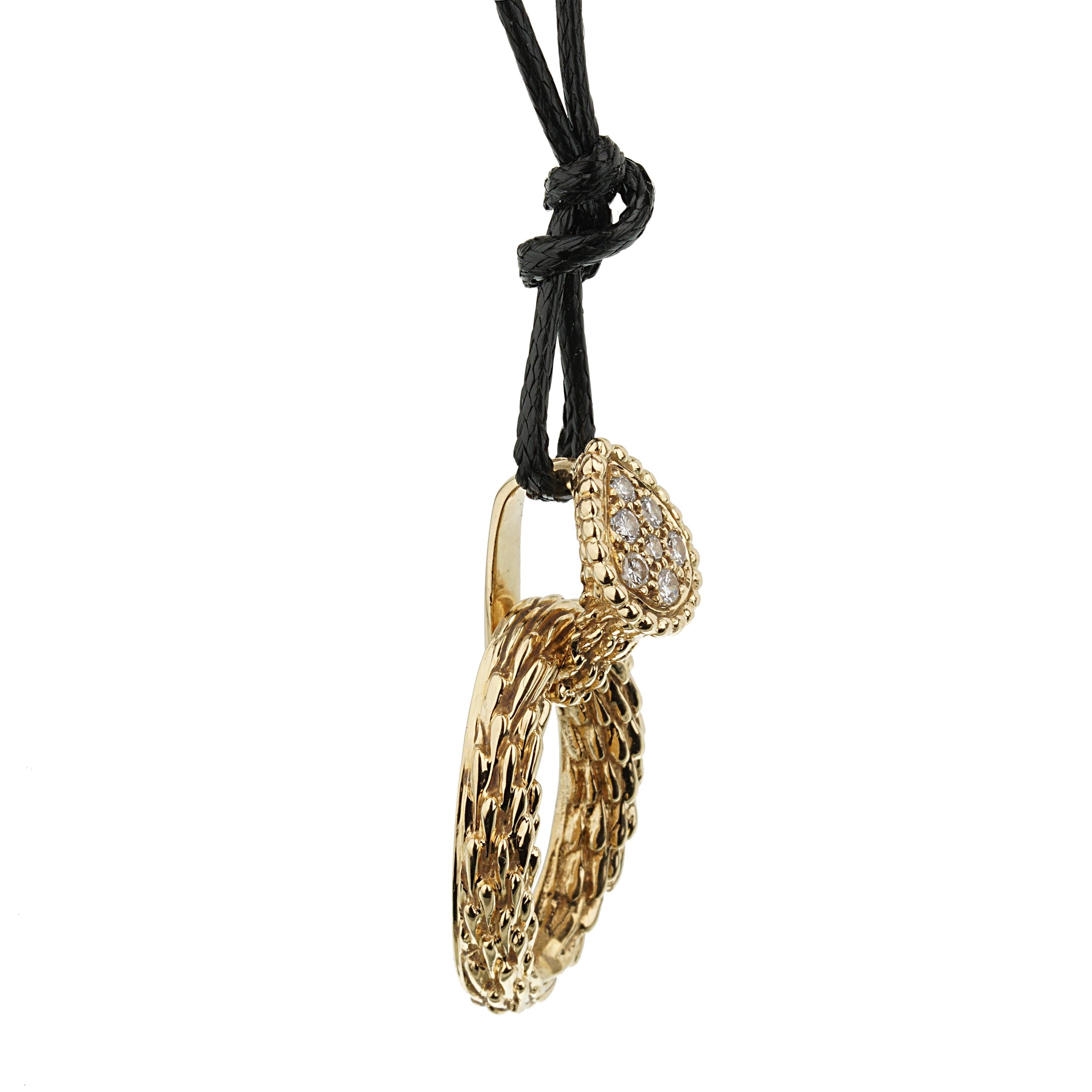 The necklace features a mesmerizing serpent motif, meticulously crafted from luxurious 18k yellow gold. The sinuous, fluid lines of the snake elegantly embrace the wearer's neck, showcasing Boucheron's dedication to creating jewelry that becomes one